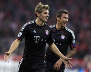 Bayern Munich's Toni Kroos celebrates his goal against Valencia with teammate Mario Mandzukic during their Champions League Group F soccer match in Munich