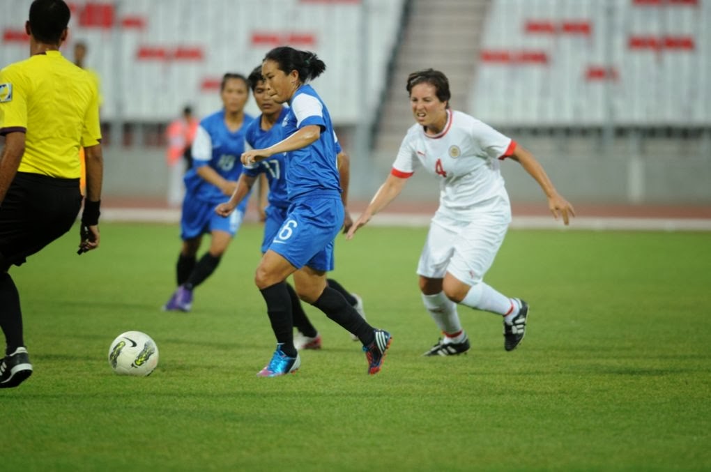 Bembem Devi ( in Blue ) with the ball