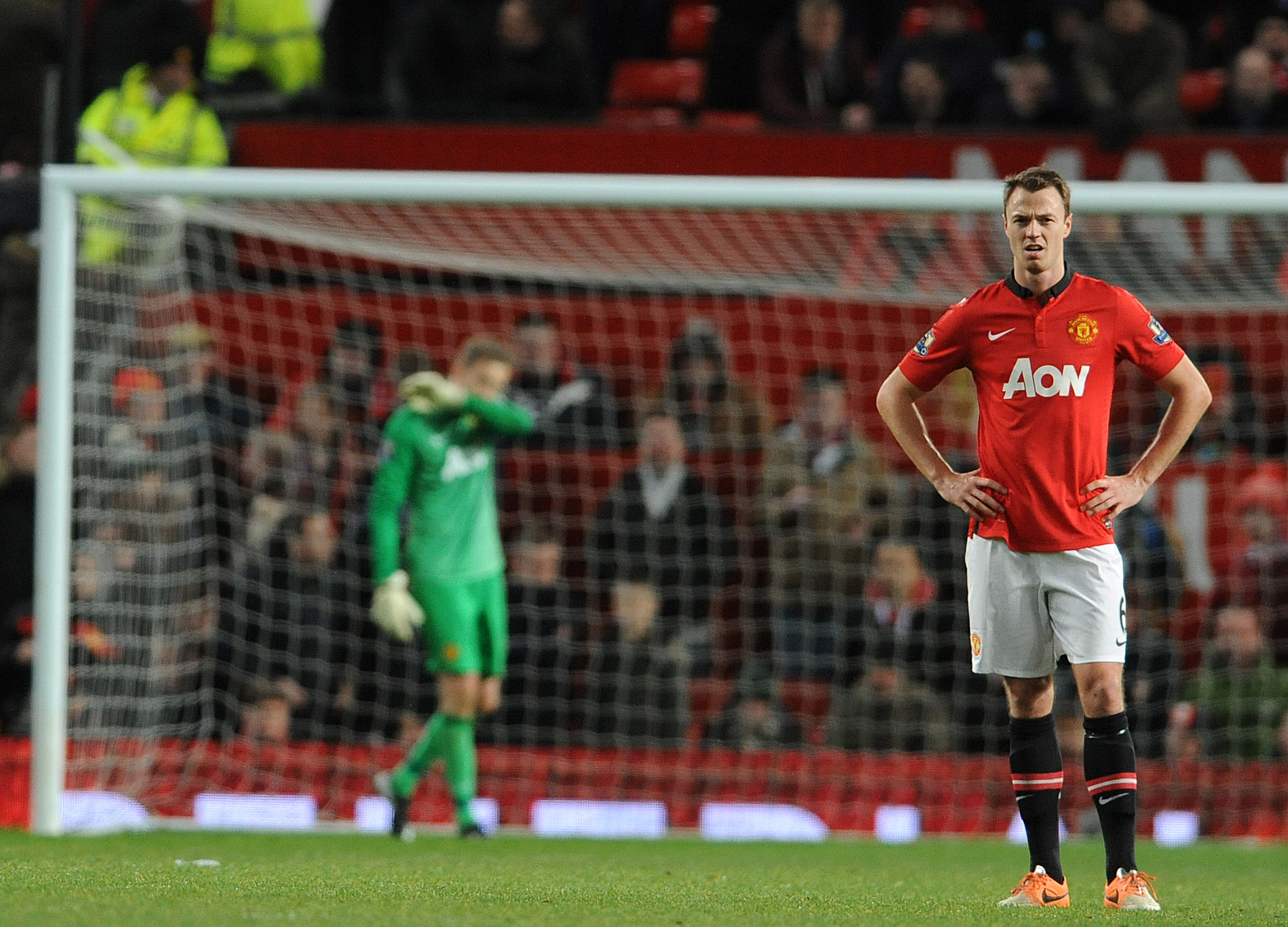epa04009280 Manchester United's Anders Lindegaard ( L ) and Manchester United's Jonny Evans ( R ) react after Swansea City's Wilfried Bony scores the winning goal during the FA cup 3rd round soccer match at Old Trafford, Manchester, Britain, 05 January 2014. EPA/PETER POWELL https://www.epa.eu/downloads/DataCo-TCs.pdf