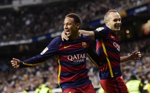 Barcelona's Brazilian forward Neymar (L) celebrates after scoring with Barcelona's midfielder Andres Iniesta during the Spanish league "Clasico" football match Real Madrid CF vs FC Barcelona at the Santiago Bernabeu stadium in Madrid on November 21, 2015. AFP PHOTO/ JAVIER SORIANOJAVIER SORIANO/AFP/Getty Images