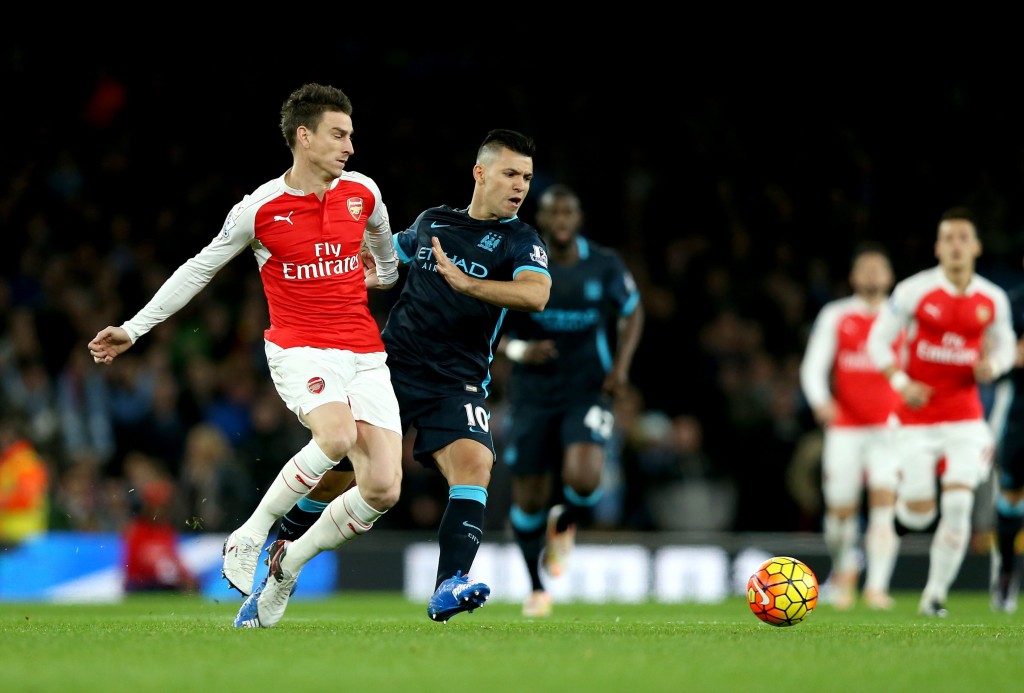 Manchester City's Sergio Aguero (C-right) and Arsenal's Laurent Koscielny battle for the ball during the English Premier League match between FC Arsenal vs Manchester City at the Emirates Stadium in London, Britain, 21 December 2015. (Photo by EPA/STR UK AND IRELAND) 