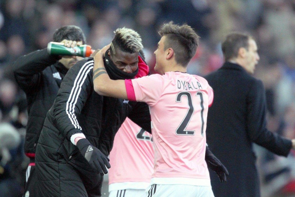 Juventus forward Paulo Dybala (R) celebrates with his teammate Paul Pogba (L) after scoring the 3-0 lead from the penalty spot during the Italian Serie A soccer match between Udinese Calcio and Juventus FC at Friuli Stadium in Udine, Italy, 17 January 2016. (Photo by Stefano Lancia/EPA)