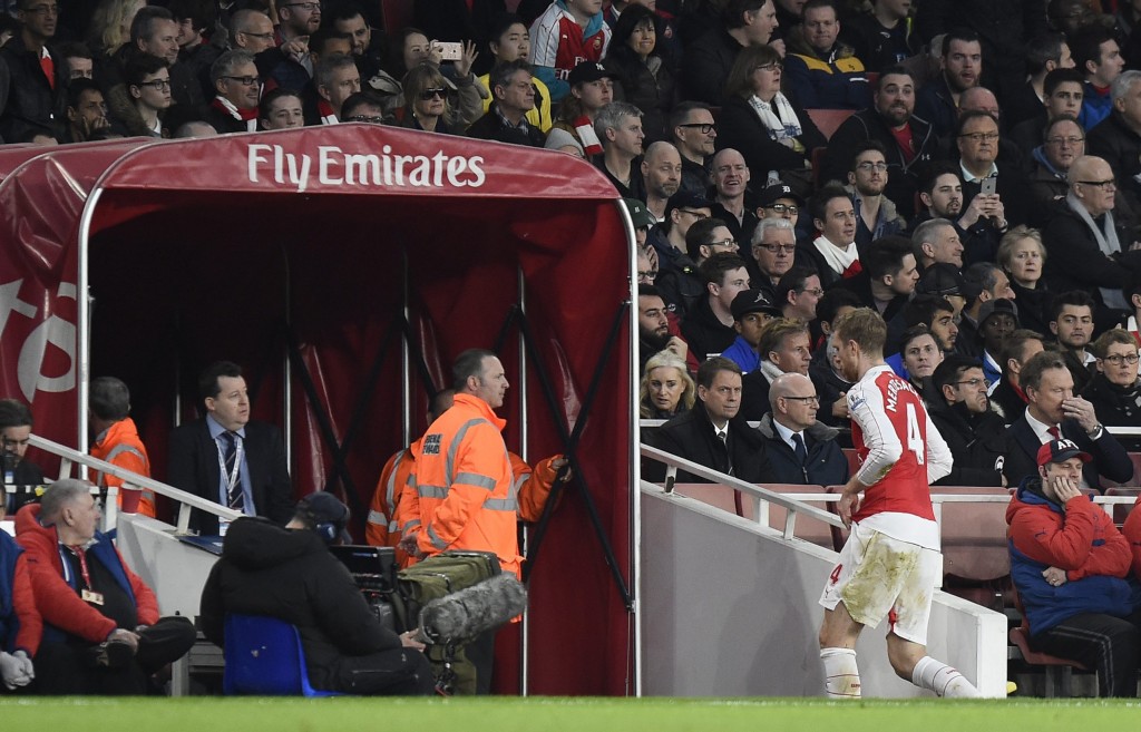 Mertesacker's injury could very well mean the departure of the German from the starting lineup for a long time as Arsene Wenger begins his search for a centre-back. (Picture Courtesy - AFP/Getty Images)