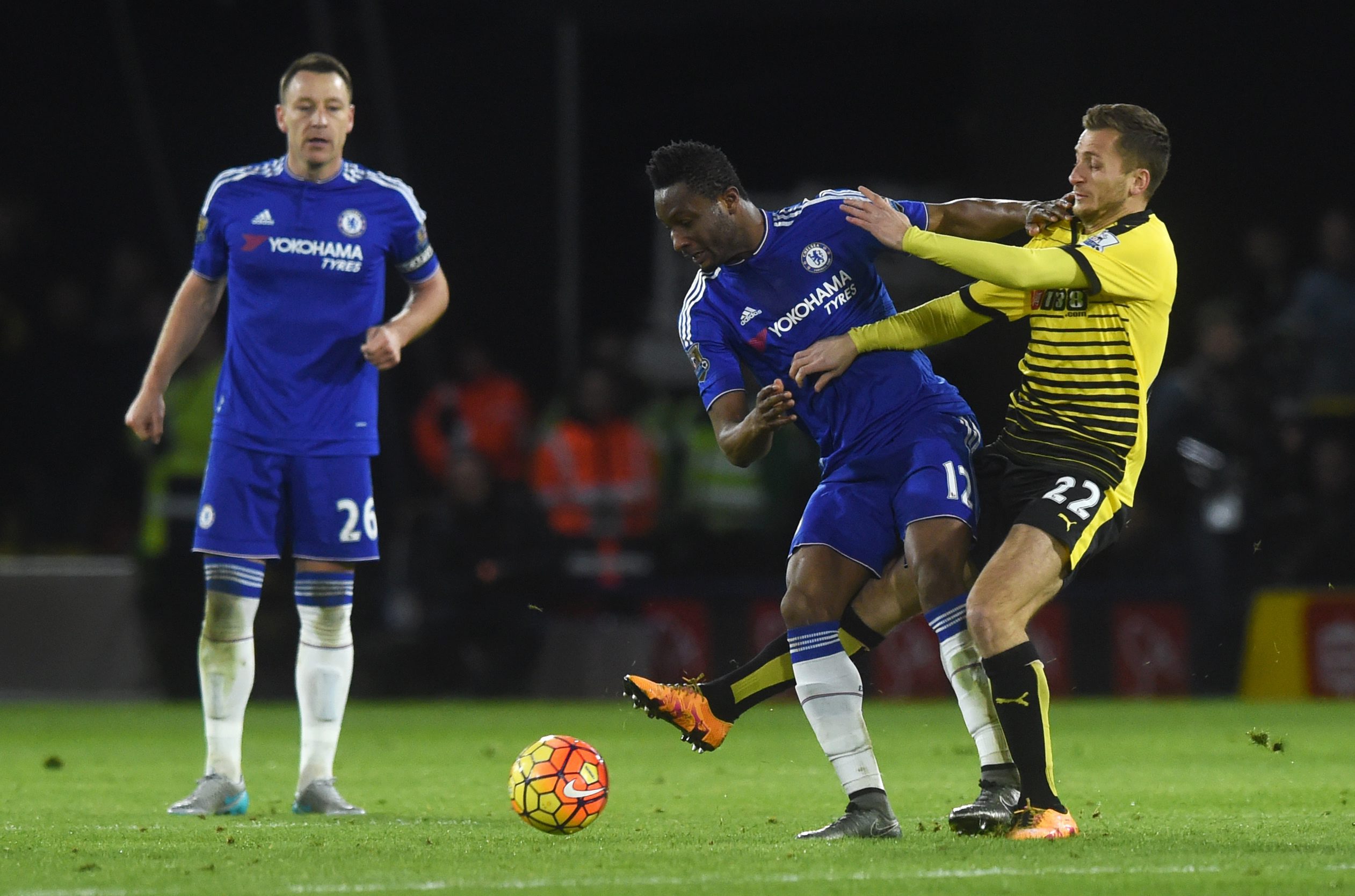 Chelsea's John Obi Mikel (centre) and Watford's Almen Abdi (right) vie for the ball during the English Premier League soccer match between Watford and Chelsea at Vicarage Road in London, Britain, 03 February 2016. EPA/WILL OLIVER