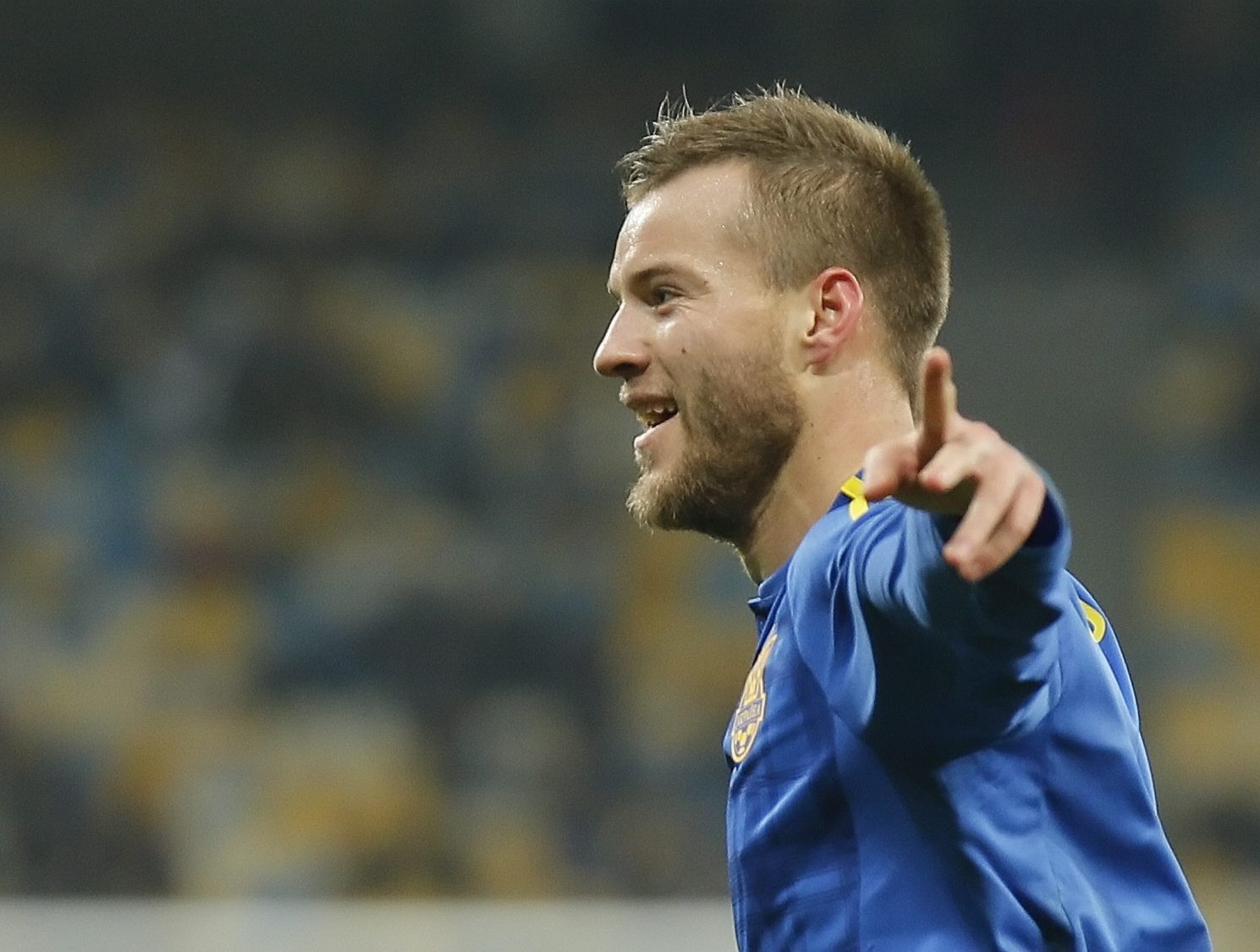 epa05233936 Andriy Yarmolenko of Ukraine celebrates after scoring a goal during the international friendly soccer match between Ukraine and Wales at the Olimpiysyi stadium in Kiev, Ukraine, 28 March 2016. EPA/SERGEY DOLZHENKO