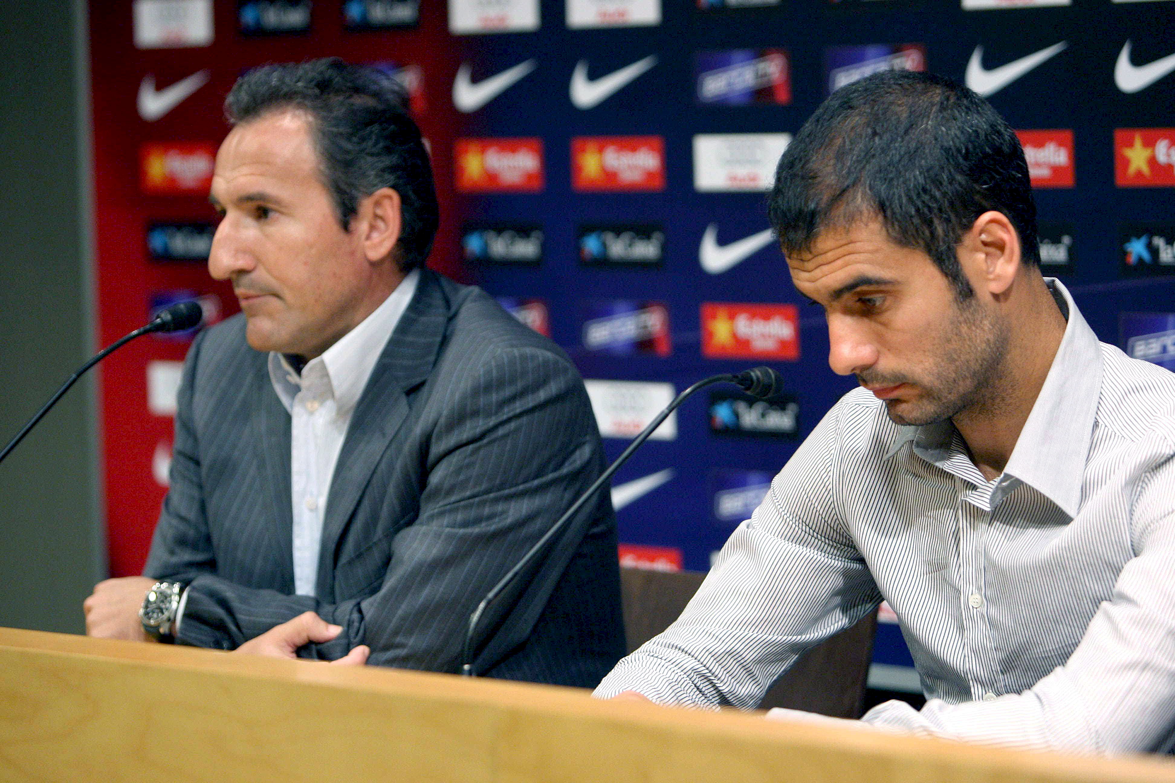epa01434189 FC Barcelona's coach Josep Guardiola (R) and FC Barcelona's Sports Director Txiki Begiristain (L) address the media to explain the club's permission for Argentinian Lionel Messi for participate in the Olympic Games 2008 at Nou Camp stadium in Barcelona, Catalonia, northeastern Spain, 07 August 2008. EPA/XAVIER BERTRAL