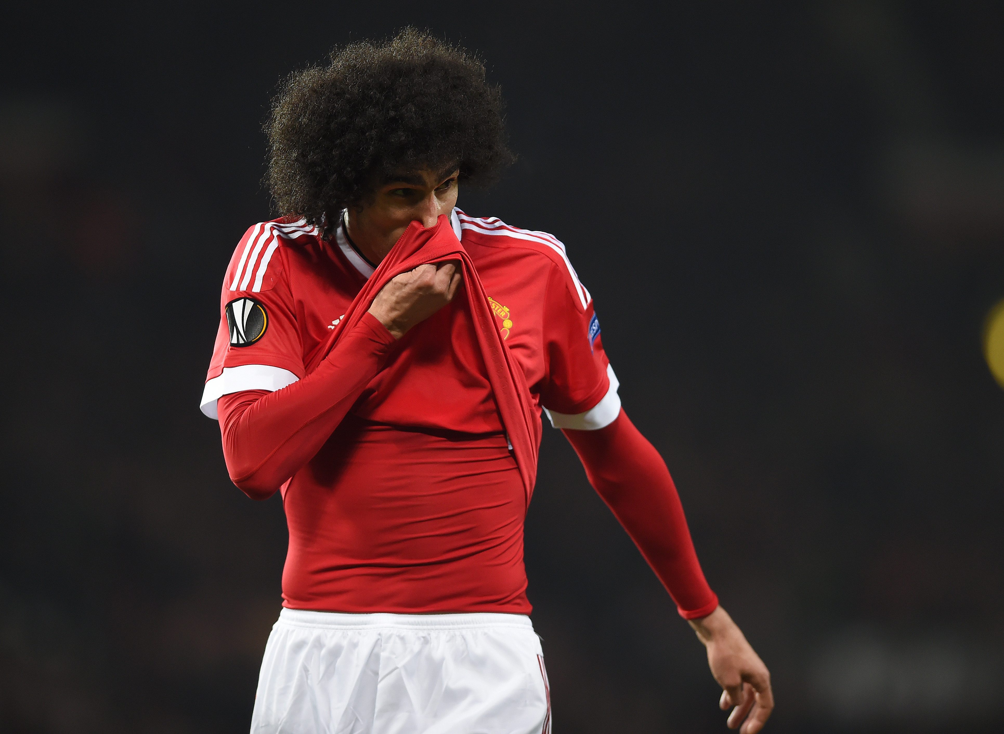 epa05217084 Manchester United's Marouane Fellaini reacts during the UEFA Europa League round of 16 soccer match between Manchester United and Liverpool at Old Trafford in Manchester, Britain, 17 March 2016. EPA/PETER POWELL