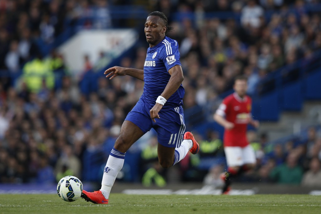 Chelsea's Ivorian striker Didier Drogba runs with the ball during the English Premier League football match between Chelsea and Manchester United at Stamford Bridge in London on April 18, 2015. AFP PHOTO / ADRIAN DENNIS RESTRICTED TO EDITORIAL USE. No use with unauthorized audio, video, data, fixture lists, club/league logos or live services. Online in-match use limited to 45 images, no video emulation. No use in betting, games or single club/league/player publications. (Photo credit should read ADRIAN DENNIS/AFP/Getty Images)