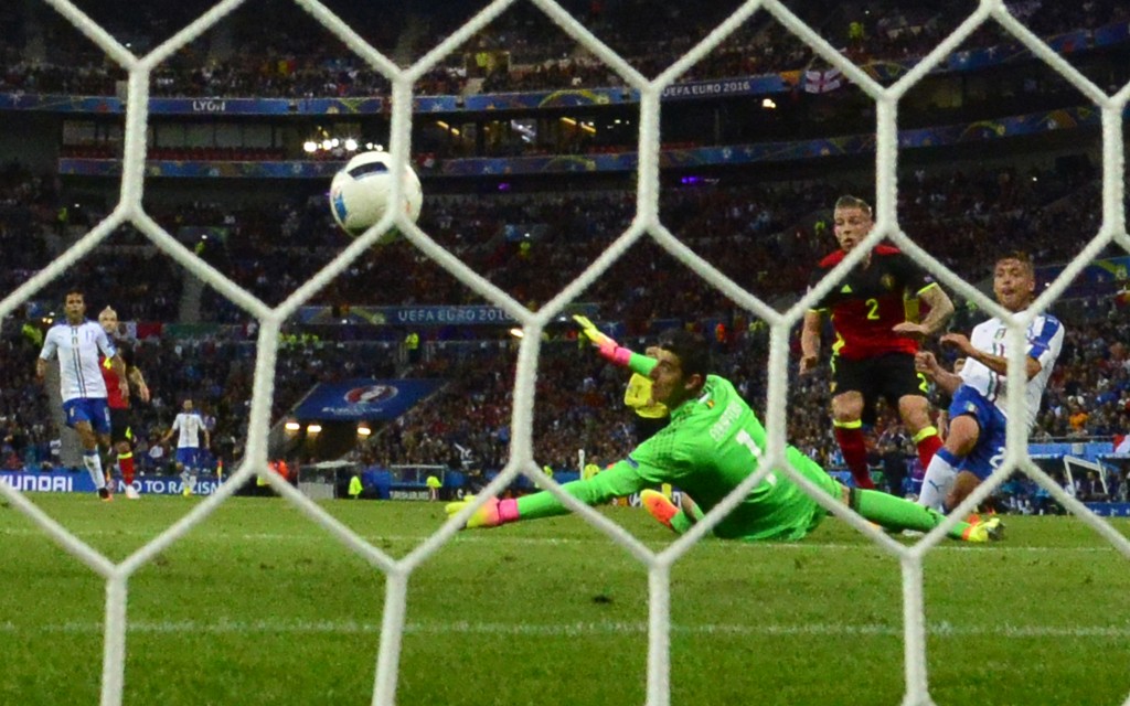 Belgium's goalkeeper Thibaut Courtois misses a goal by Italy's midfielder Emanuele Giaccherini during the Euro 2016 group E football match between Belgium and Italy at the Parc Olympique Lyonnais stadium in Lyon on June 13, 2016. / AFP / EMMANUEL DUNAND (Photo credit should read EMMANUEL DUNAND/AFP/Getty Images)