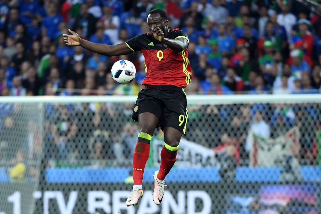Belgium's forward Romelu Lukaku jumps for the ball during the Euro 2016 group E football match between Belgium and Italy at the Parc Olympique Lyonnais stadium in Lyon on June 13, 2016. / AFP / EMMANUEL DUNAND (Photo credit should read EMMANUEL DUNAND/AFP/Getty Images)