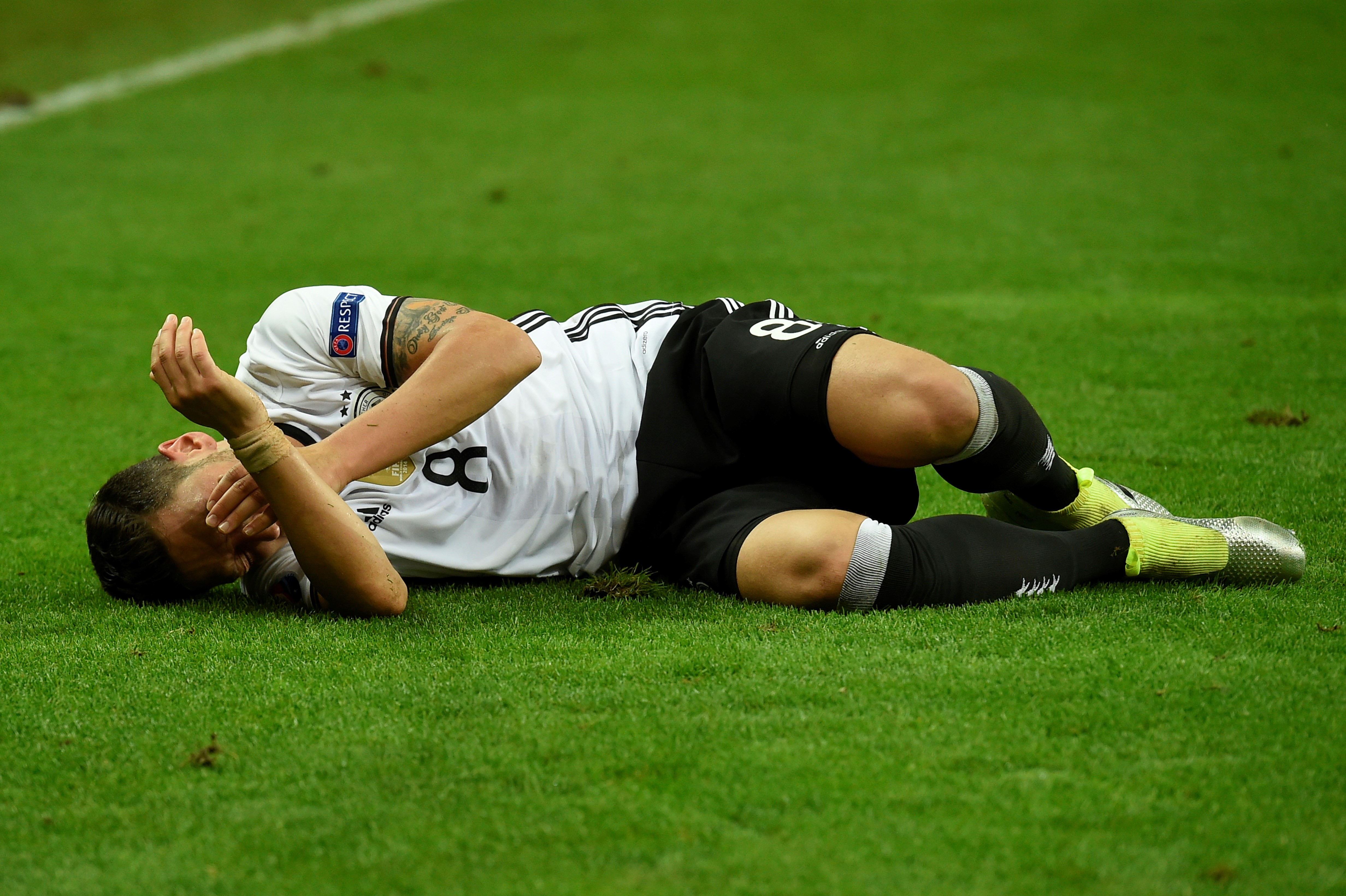 Germany's midfielder Mesut Oezil reacts on the pitch during the Euro 2016 group C football match between Germany and Poland at the Stade de France stadium in Saint-Denis near Paris on June 16, 2016. / AFP / LIONEL BONAVENTURE (Photo credit should read LIONEL BONAVENTURE/AFP/Getty Images)