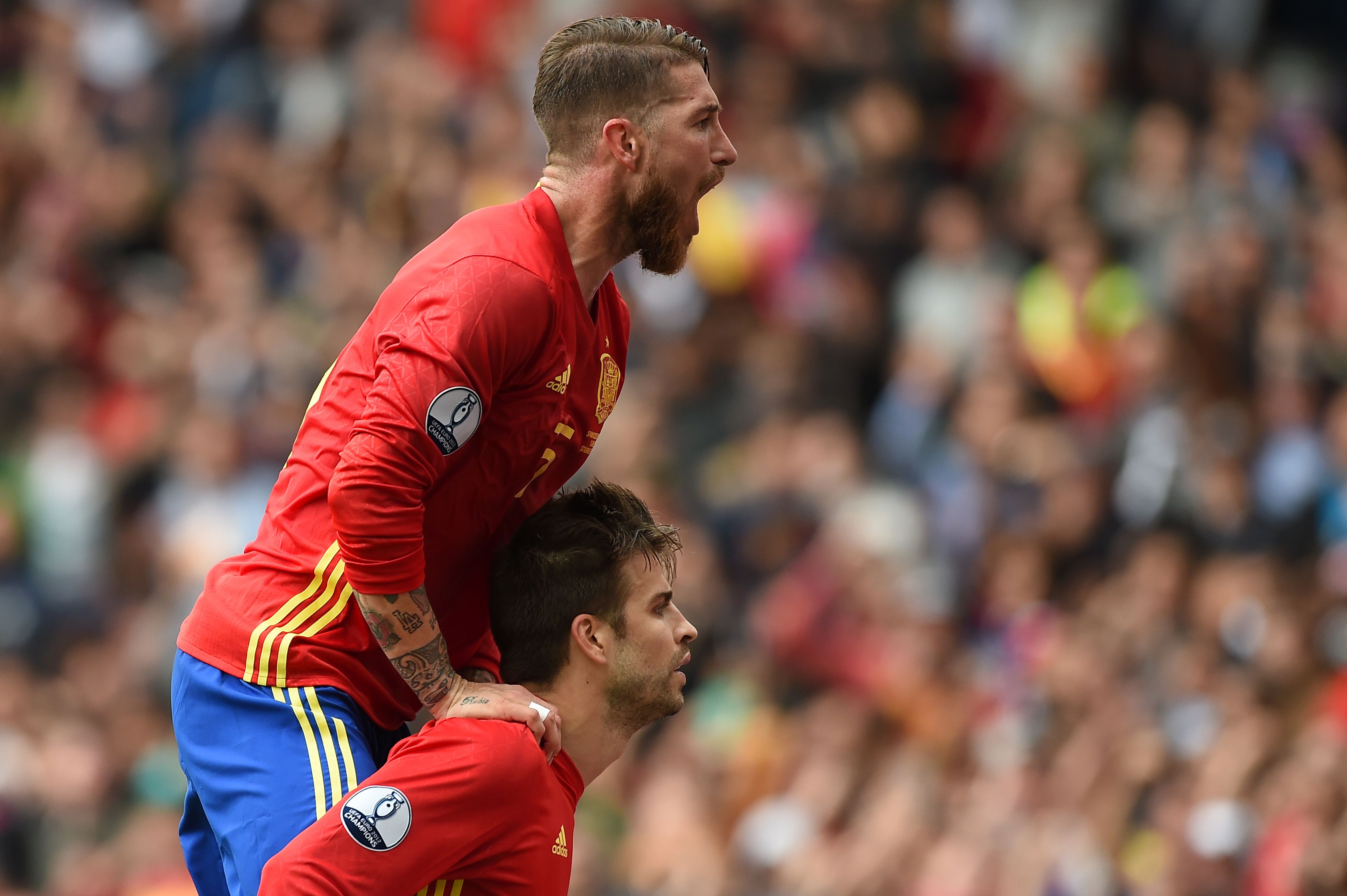 Spain's defender Gerard Pique and Spain's defender Sergio Ramos celebrate after Pique scored the opening goal during the Euro 2016 group D football match between Spain and Czech Republic at the Stadium Municipal in Toulouse on June 13, 2016. / AFP / NICOLAS TUCAT (Photo credit should read NICOLAS TUCAT/AFP/Getty Images)