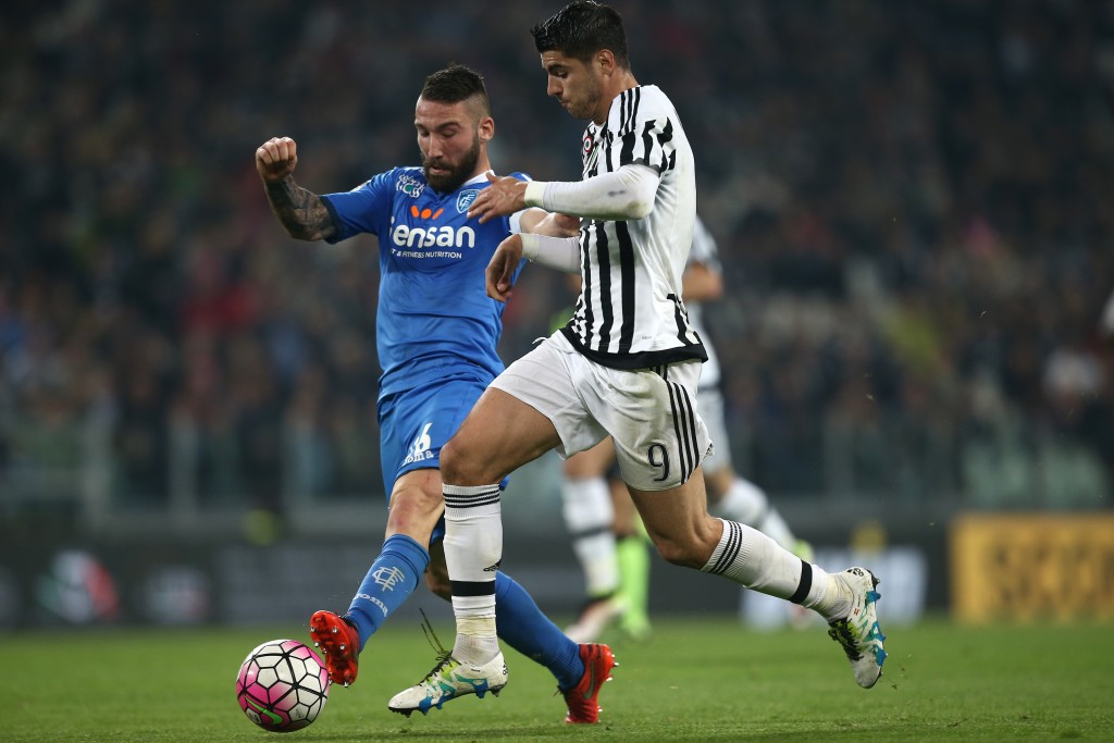 Empoli's defender Lorenzo Tonelli (L) fights for the ball with Juventus' forward Alvaro Morata from Spain during the Italian Serie A football match Juventus Vs Empoli on April 2, 2016 at the "Juventus Stadium" in Turin. / AFP / MARCO BERTORELLO (Photo credit should read MARCO BERTORELLO/AFP/Getty Images)