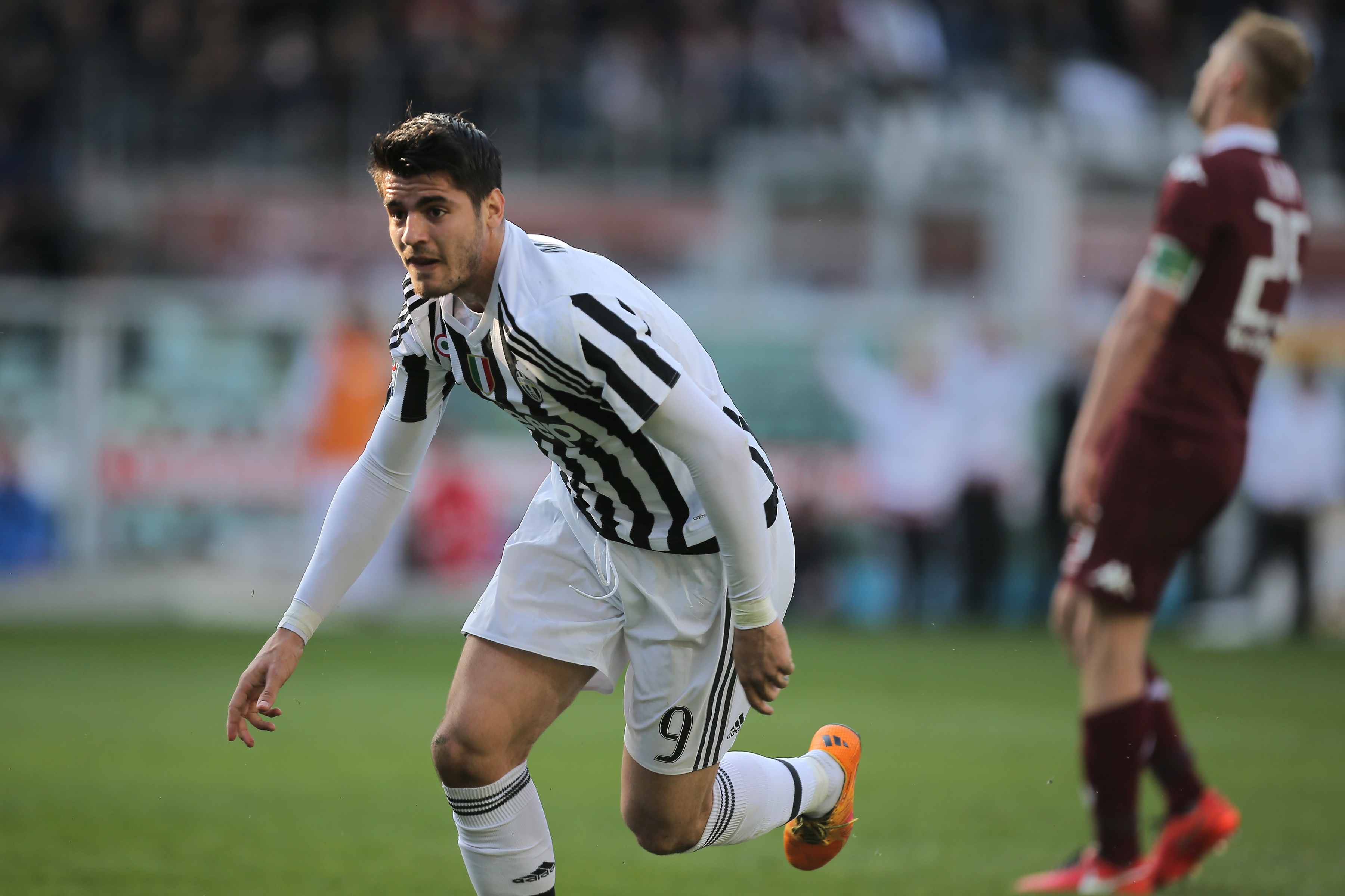 Juventus' forward Alvaro Morata from Spain celebrates after scoring during the Italian Serie A football match Torino Vs Juventus on March 20, 2016 at the "Olympic Stadium" in Turin.  / AFP / MARCO BERTORELLO        (Photo credit should read MARCO BERTORELLO/AFP/Getty Images)