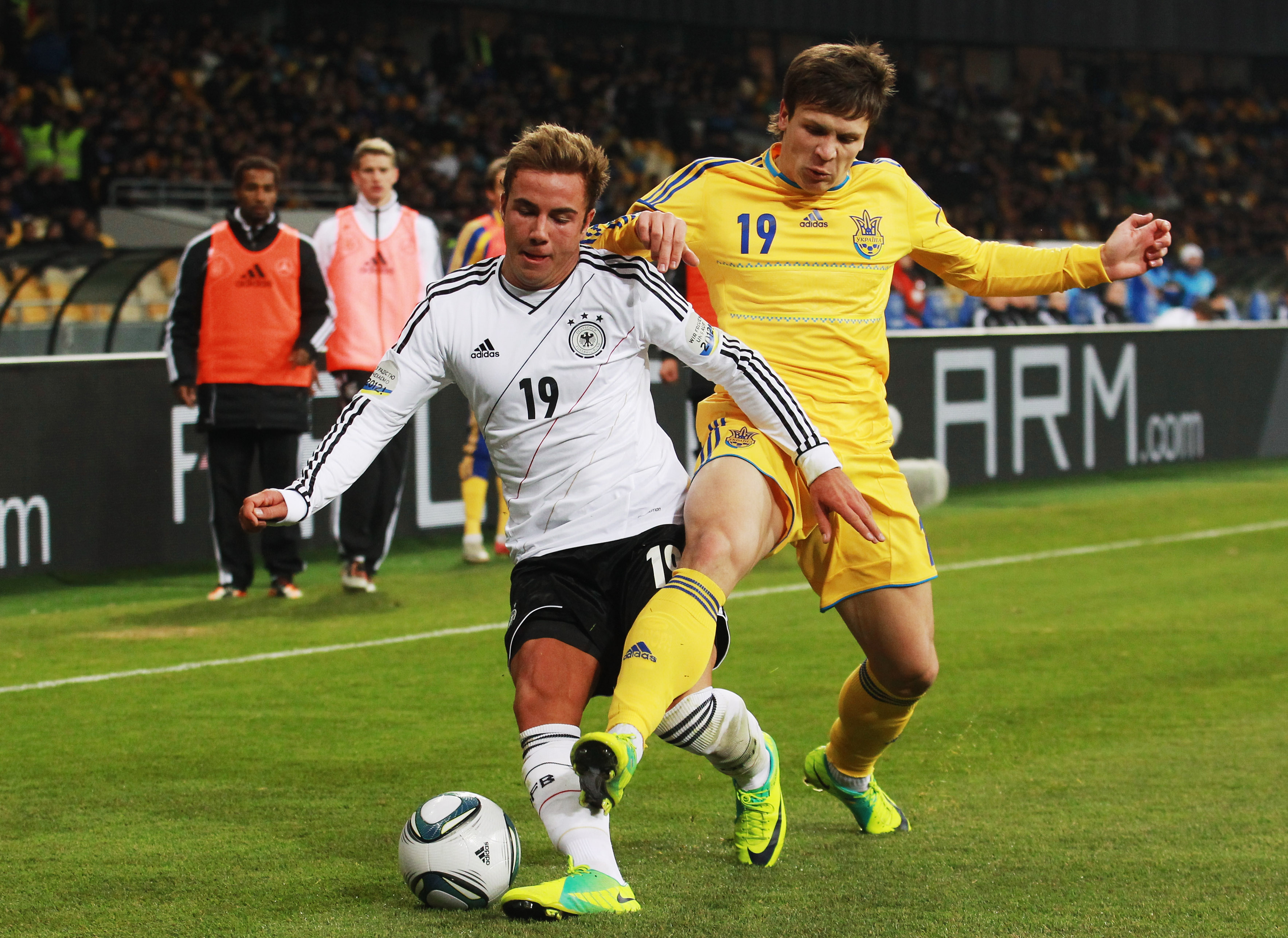 KIEV, UKRAINE - NOVEMBER 11: Yevhen Konoplianka (R) of Ukraine and Mario Goetze of Germany battle for the ball during the International Friendly match between Ukraine and Germany at Olympiyskiy Stadium on November 11, 2011 in Kiev, Ukraine. (Photo by Joern Pollex/Bongarts/Getty Images)