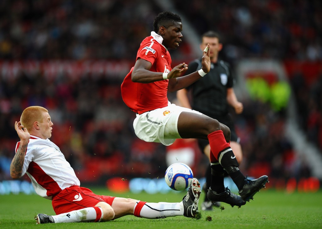 MANCHESTER, ENGLAND - MAY 23: Paul Pogba of Manchester United is tackled by Terry Kennedy of Sheffield United during the FA Youth Cup Final 2nd Leg match between Manchester United and Sheffield United at Old Trafford on May 23, 2011 in Manchester, England. (Photo by Laurence Griffiths/Getty Images)