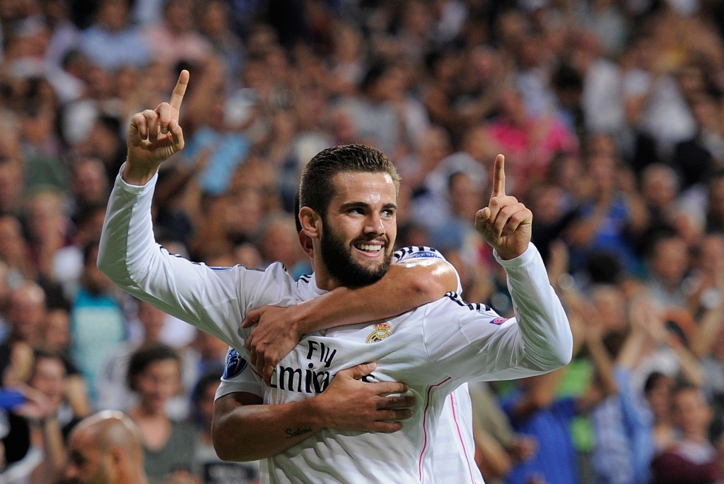 MADRID, SPAIN - SEPTEMBER 16: Nacho Fernandez of Real Madrid celebrates after scoring Real's opening goal during the UEFA Champions League Group B match between Real Madrid CF and FC Basel 1893 on September 16, 2014 in Madrid, Spain. (Photo by Denis Doyle/Getty Images)
