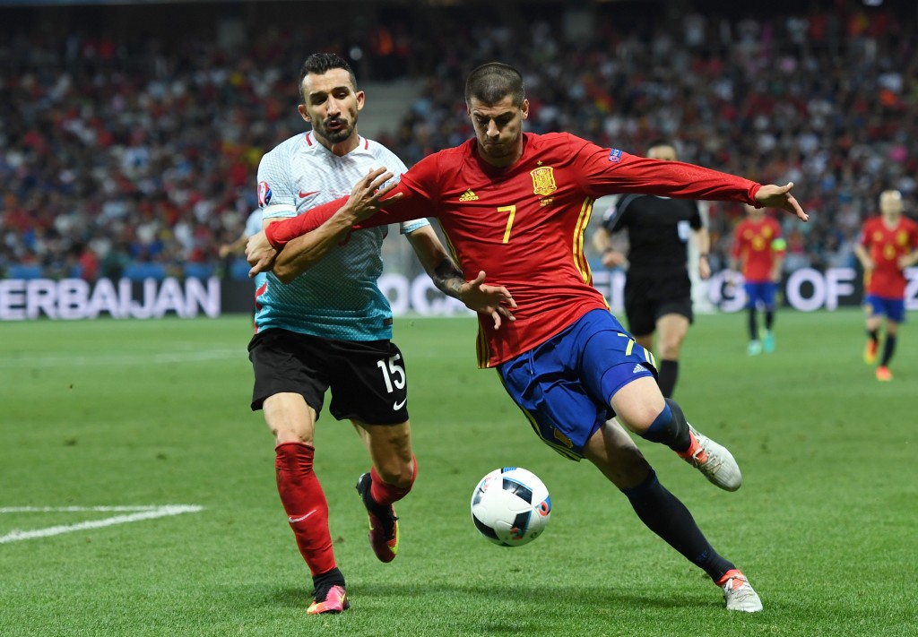 NICE, FRANCE - JUNE 17: Mehmet Topal of Turkey chases down Alvaro Morata of Spain during the UEFA EURO 2016 Group D match between Spain and Turkey at Allianz Riviera Stadium on June 17, 2016 in Nice, France. (Photo by David Ramos/Getty Images)