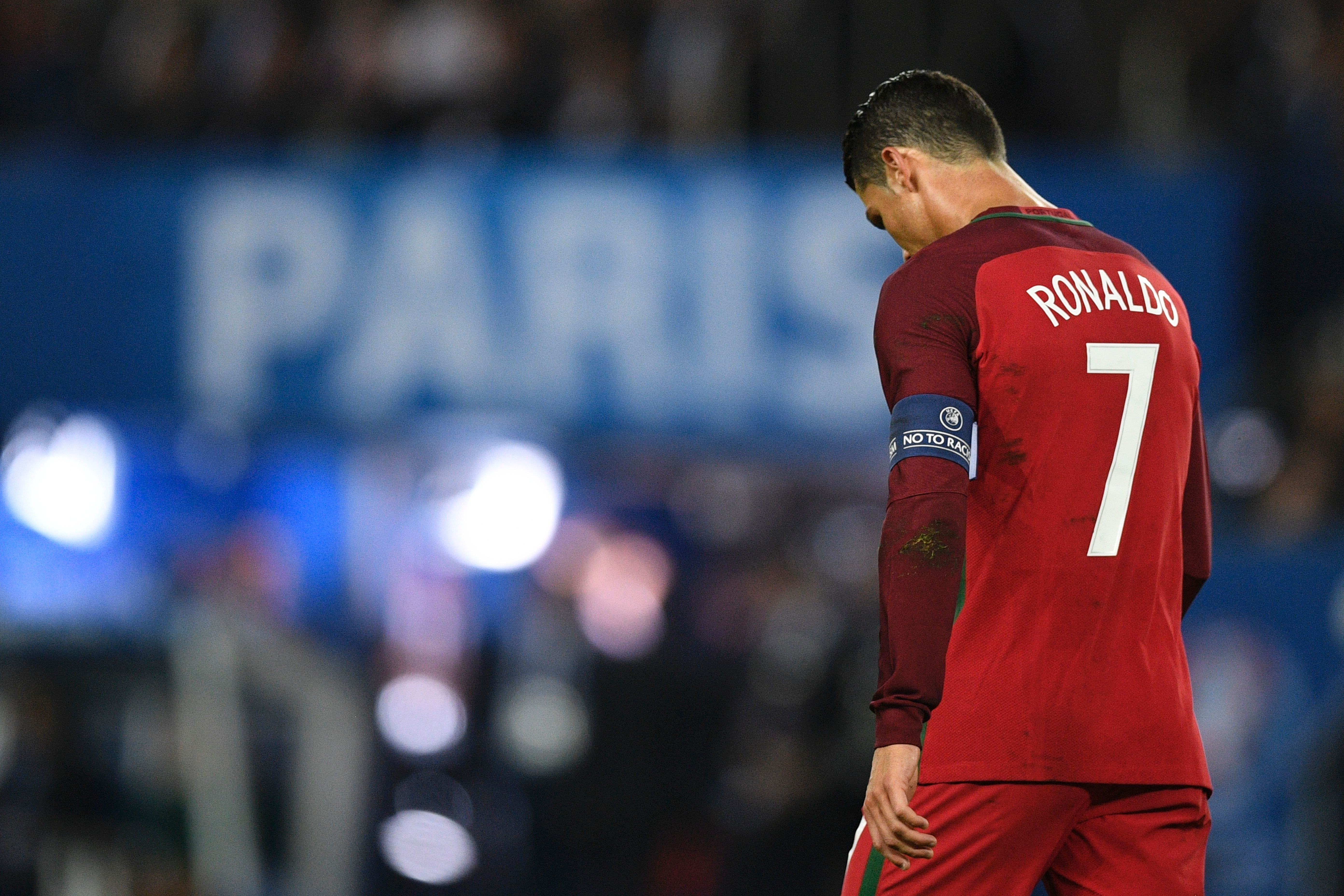 TOPSHOT - Portugal's forward Cristiano Ronaldo reacts after he missed to score a penalty during the Euro 2016 group F football match between Portugal and Austria at the Parc des Princes in Paris on June 18, 2016. / AFP / MARTIN BUREAU (Photo credit should read MARTIN BUREAU/AFP/Getty Images)