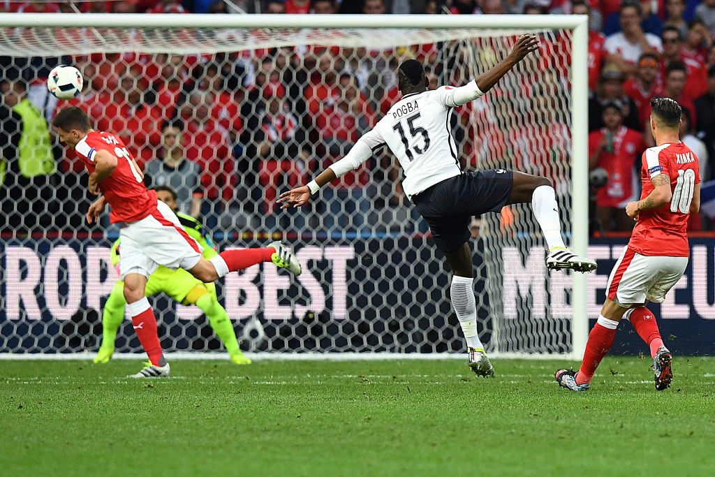 TOPSHOT - Switzerland's goalkeeper Yann Sommer and France's midfielder Paul Pogba eye the ball during the Euro 2016 group A football match between Switzerland and France at the Pierre-Mauroy stadium in Lille on June 19, 2016. / AFP / FRANCK FIFE (Photo credit should read FRANCK FIFE/AFP/Getty Images)