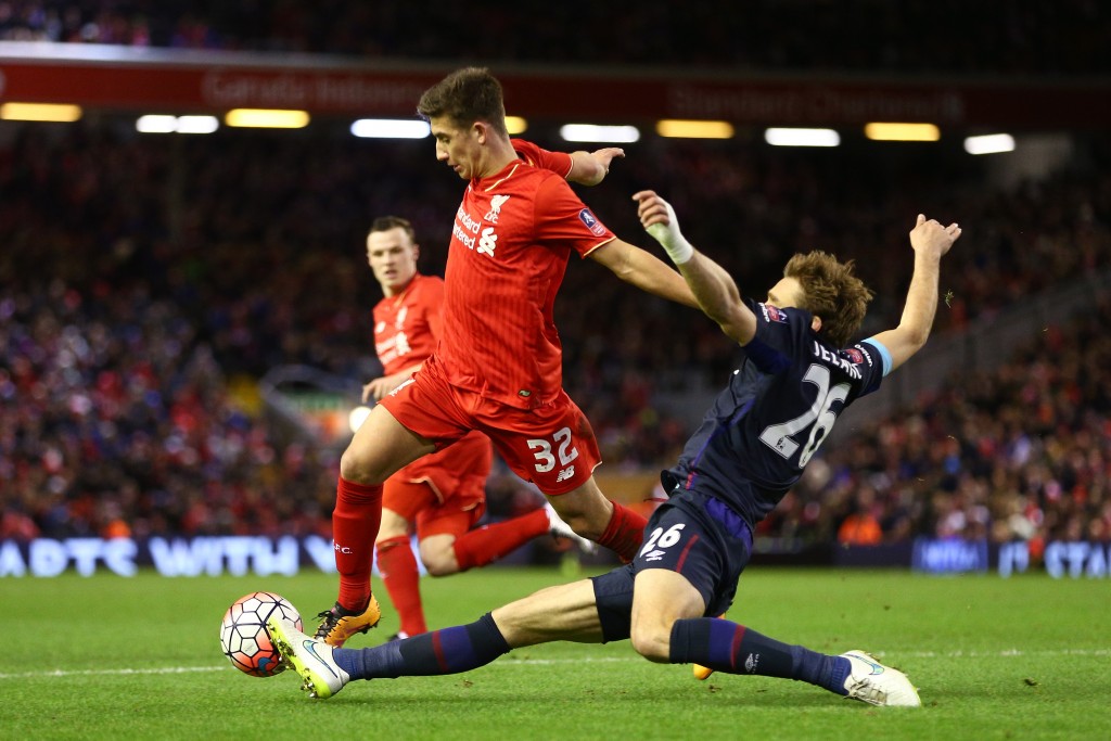 LIVERPOOL, ENGLAND - JANUARY 30: Cameron Brannagan of Liverpool is tackled by Nikica Jelavic of West Ham United during the Emirates FA Cup Fourth Round match between Liverpool and West Ham United at Anfield on January 30, 2016 in Liverpool, England. (Photo by Clive Brunskill/Getty Images)