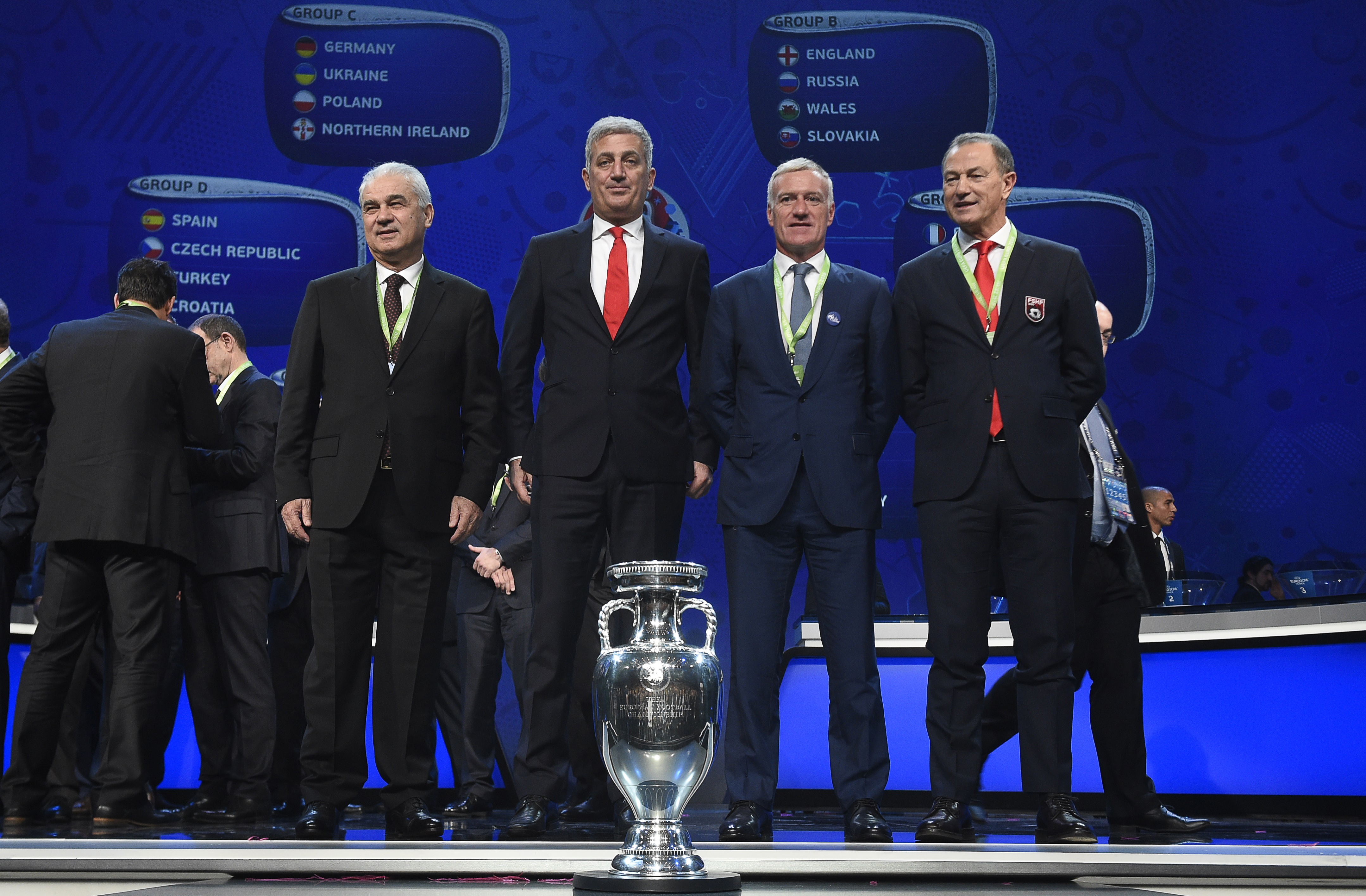Representatives of teams drawn in group A (L-R) Romania's coach Anghel Iordanescu, Switzerland's coach Vladimir Petkovic, France's coach Didier Deschamps and Albania's Italian coach Gianni de Biasi pose after the final draw of the UEFA Euro 2016 football tournament in Paris on December 12, 2015. AFP PHOTO / LIONEL BONAVENTURE / AFP / LIONEL BONAVENTURE (Photo credit should read LIONEL BONAVENTURE/AFP/Getty Images)