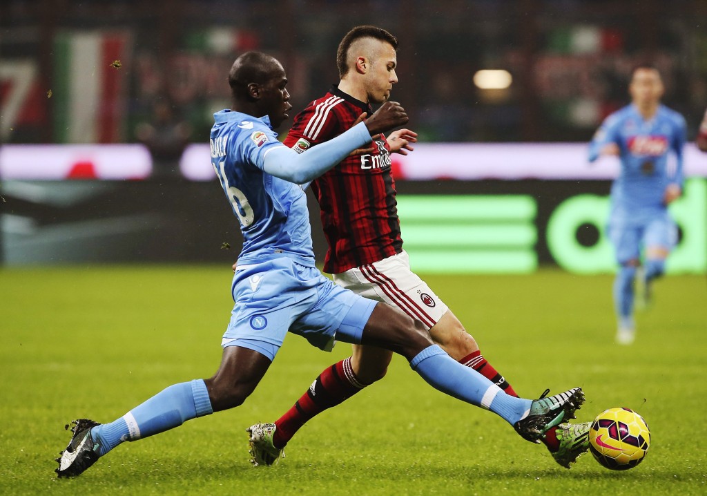 MILAN, ITALY - DECEMBER 14: Jeremy Menez (R) of AC Milan is challenged by Kalidou Koulibaly (L) of SSC Napoli during the Serie A match between AC Milan and SSC Napoli at Stadio Giuseppe Meazza on December 14, 2014 in Milan, Italy. (Photo by Marco Luzzani/Getty Images)