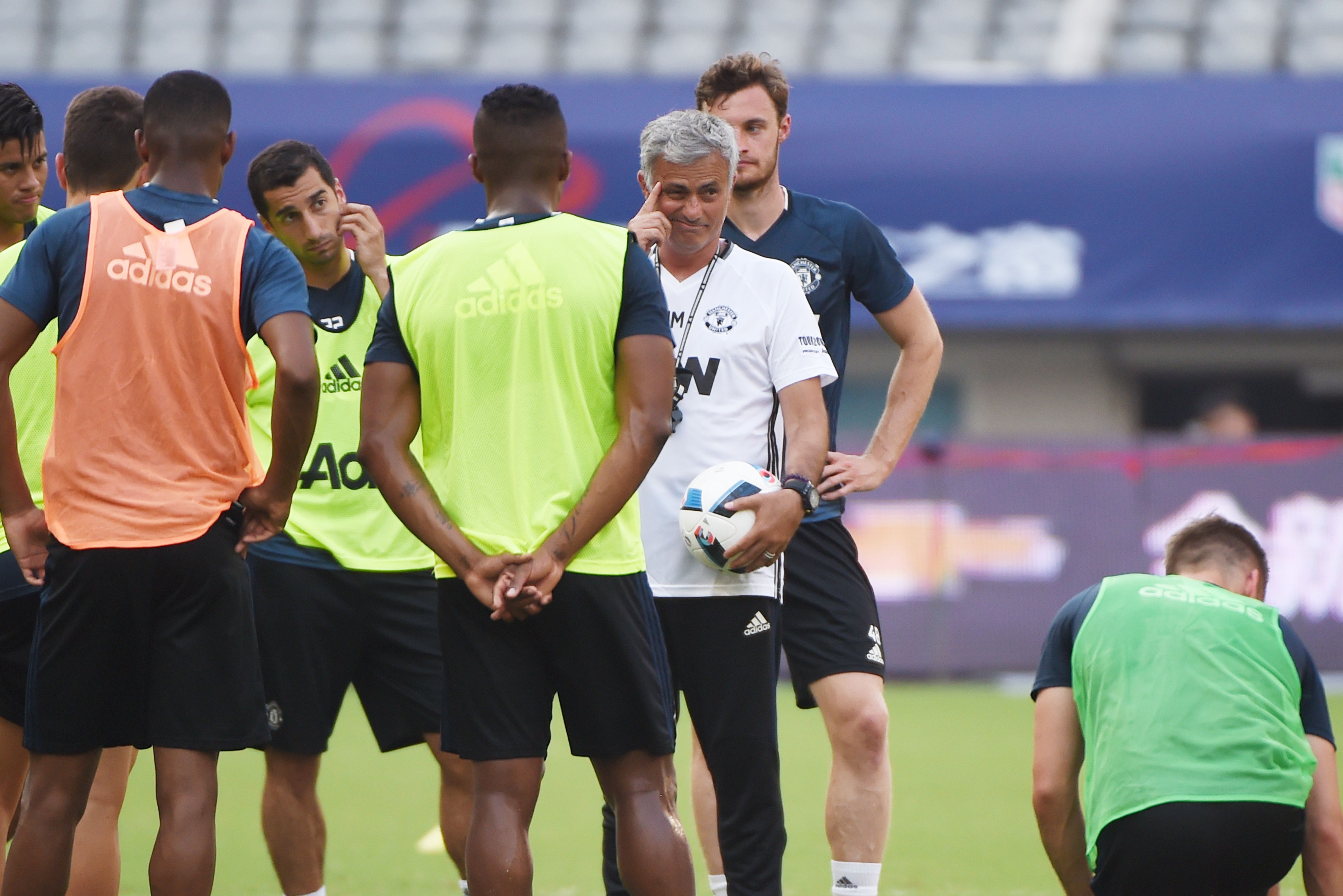 Manchester United's head coach Jose Mourinho (C) reacts as he takes part in a training session with teammates ahead of the 2016 International Champions Cup football match between Manchester United and Dortmund in Shanghai on July 21, 2016. / AFP / WANG ZHAO (Photo credit should read WANG ZHAO/AFP/Getty Images)
