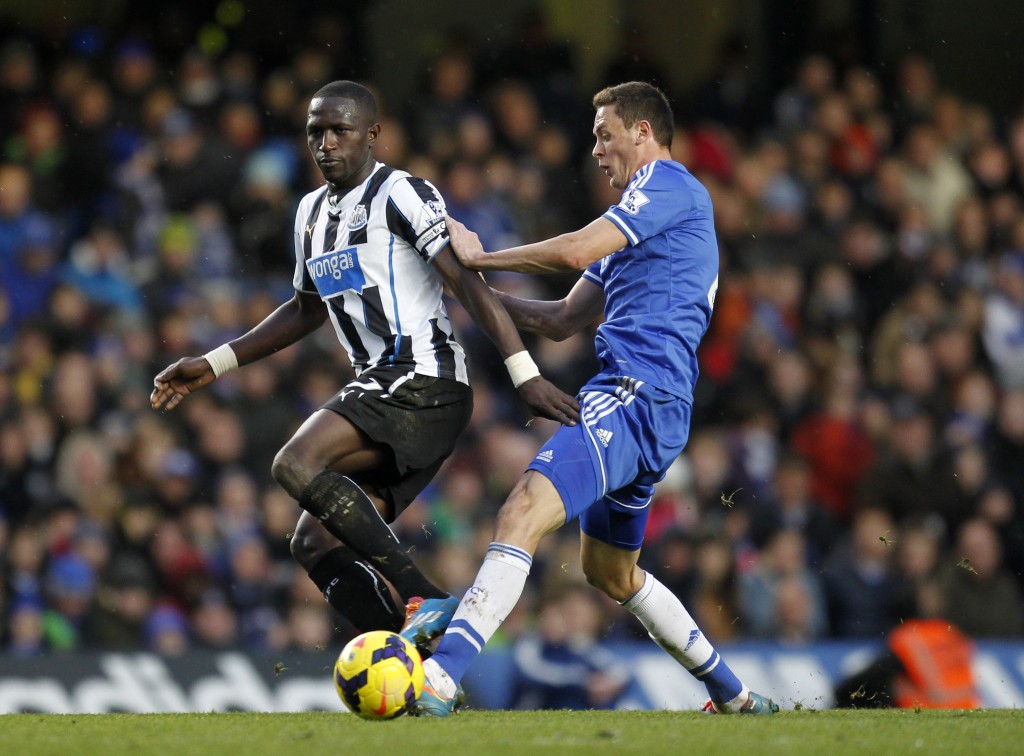Newcastle United's French midfielder Moussa Sissoko (L) vies with Chelsea's Serbian midfielder Nemanja Matic during the English Premier League football match between Chelsea and Newcastle United at Stamford Bridge in west London on February 8, 2014. Chelsea won 3-0. AFP PHOTO / IAN KINGTON RESTRICTED TO EDITORIAL USE. No use with unauthorized audio, video, data, fixture lists, club/league logos or live services. Online in-match use limited to 45 images, no video emulation. No use in betting, games or single club/league/player publications. (Photo credit should read IAN KINGTON/AFP/Getty Images)