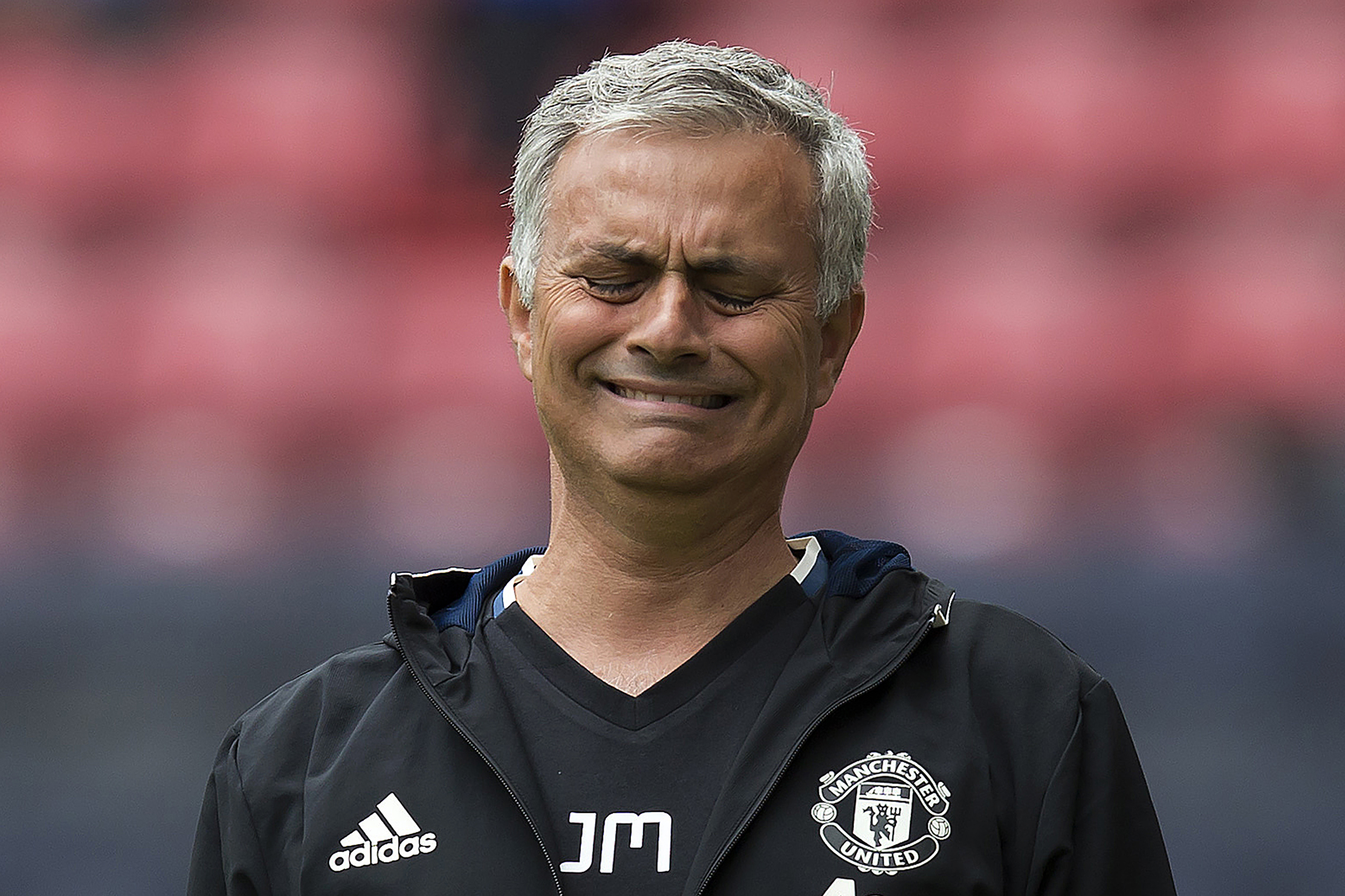 Manchester United's Portuguese manager Jose Mourinho reacts during the pre-season friendly football match between Wigan Athletic and Manchester United at the DW stadium in Wigan, northwest England, on July 16, 2016. / AFP / JON SUPER / RESTRICTED TO EDITORIAL USE. No use with unauthorized audio, video, data, fixture lists, club/league logos or 'live' services. Online in-match use limited to 75 images, no video emulation. No use in betting, games or single club/league/player publications. / (Photo credit should read JON SUPER/AFP/Getty Images)