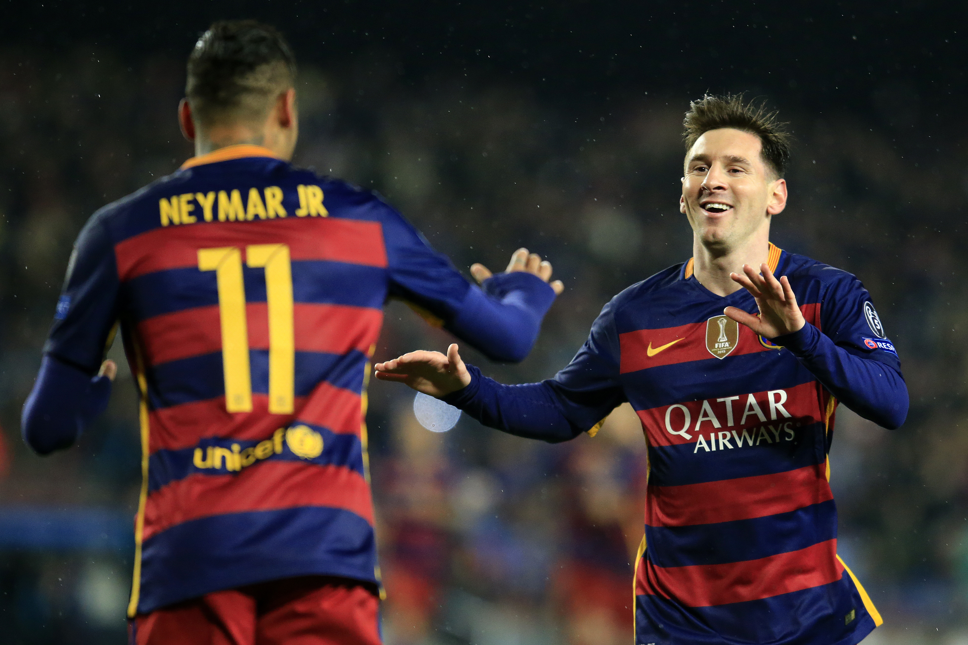Barcelona's Brazilian forward Neymar (L) celebrates a goal with Barcelona's Argentinian forward Lionel Messi during the UEFA Champions League Round of 16 second leg football match FC Barcelona vs Arsenal FC at the Camp Nou stadium in Barcelona on March 16, 2016. / AFP / PAU BARRENA (Photo credit should read PAU BARRENA/AFP/Getty Images)
