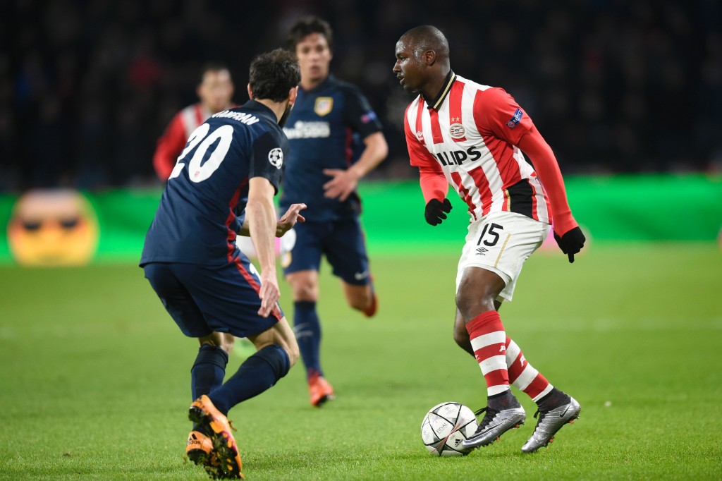 PSV Eindhoven's defender Jetro Willems (R) challenges Atletico Madrid's defender Juanfran during the UEFA Champions League round of 16 first leg football match between PSV Eindhoven and Atletico Madrid at the Philips Stadium in Eindhoven on February 24, 2016. AFP PHOTO / JOHN THYS / AFP / JOHN THYS (Photo credit should read JOHN THYS/AFP/Getty Images)