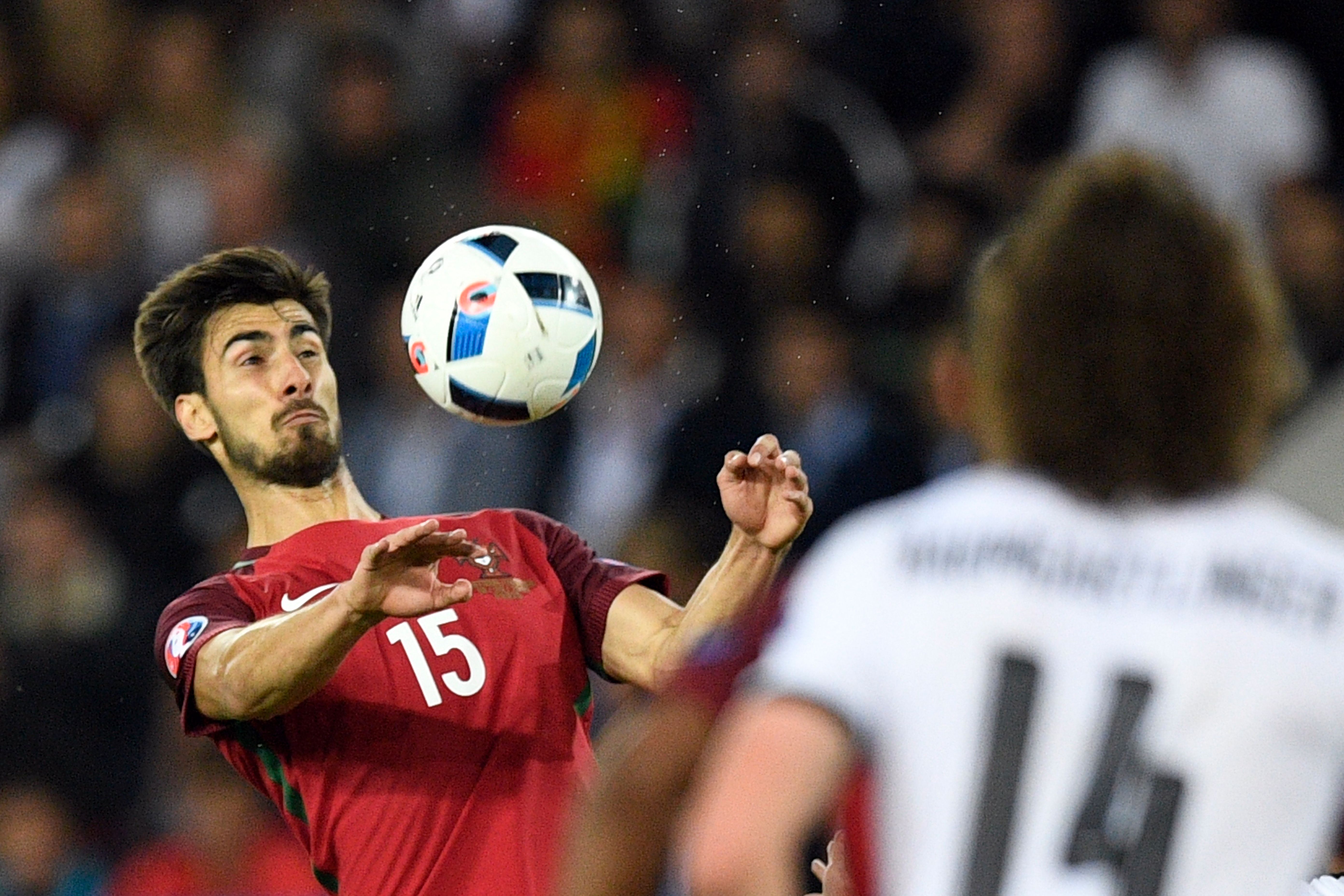 Portugal's midfielder Andre Gomes (L) plays the ball during the Euro 2016 group F football match between Portugal and Austria at the Parc des Princes in Paris on June 18, 2016. / AFP / MARTIN BUREAU (Photo credit should read MARTIN BUREAU/AFP/Getty Images)