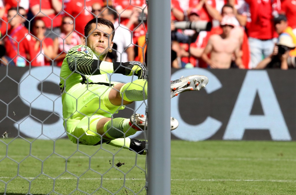 Poland's goalkeeper Lukasz Fabianski reacts as Switzerland's midfielder Granit Xhaka (not pictured) failed to score during penalty shoot-out during the Euro 2016 round of sixteen football match between Switzerland and Poland at the Geoffroy-Guichard stadium in Saint-Etienne on June 25, 2016. / AFP / Valery HACHE (Photo credit should read VALERY HACHE/AFP/Getty Images)