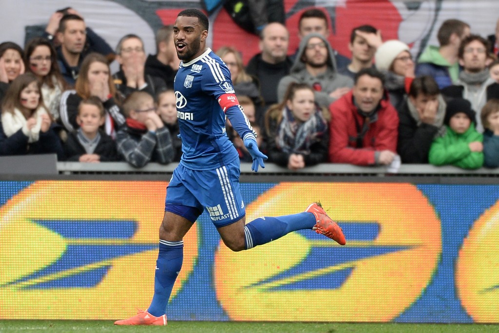 Lyon's French forward Alexandre Lacazette celebrates after scoring a goal during the French L1 football match between Guingamp and Lyon on April 4, 2015 at the Roudourou stadium in Guingamp, western France. (Photo credit: Jean-Sebastien Evrard/AFP/Getty Images)