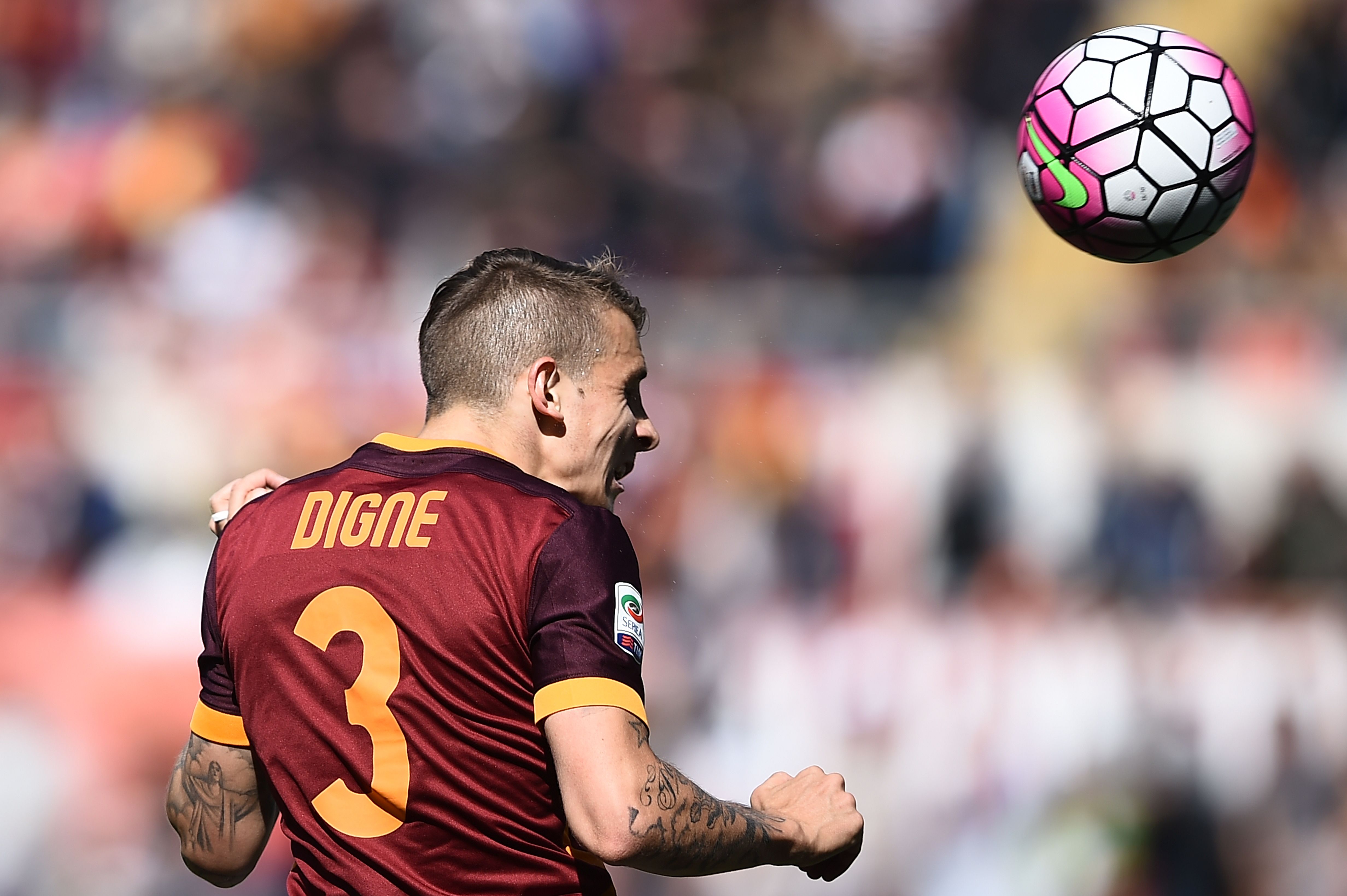 Roma's defender from France Lucas Digne heads the ball during the Italian Serie A football match AS Roma vs Napoli on April 25, 2016 at the Olympic Stadium in Rome. AFP PHOTO / FILIPPO MONTEFORTE / AFP / FILIPPO MONTEFORTE (Photo credit should read FILIPPO MONTEFORTE/AFP/Getty Images)