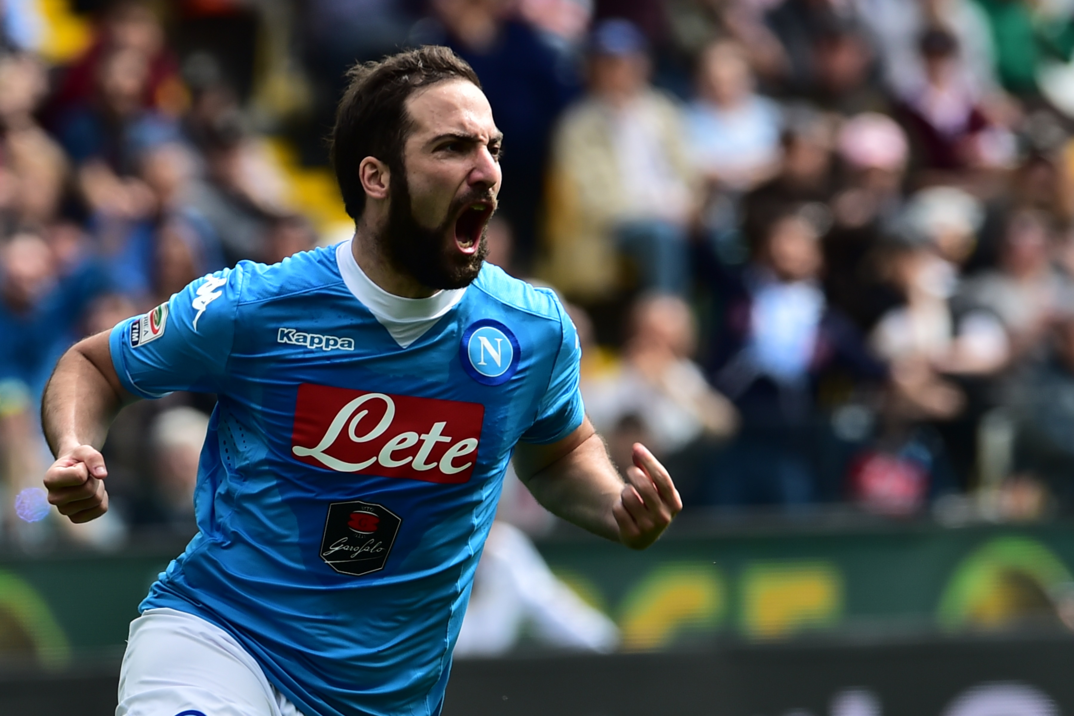 Napoli's forward from Argentina Gonzalo Higuain celebtrates after scoring during the Italian Serie A football match Udinese vs Napoli at Friuli Stadium in Udine on April 3, 2016.   / AFP / GIUSEPPE CACACE        (Photo credit should read GIUSEPPE CACACE/AFP/Getty Images)