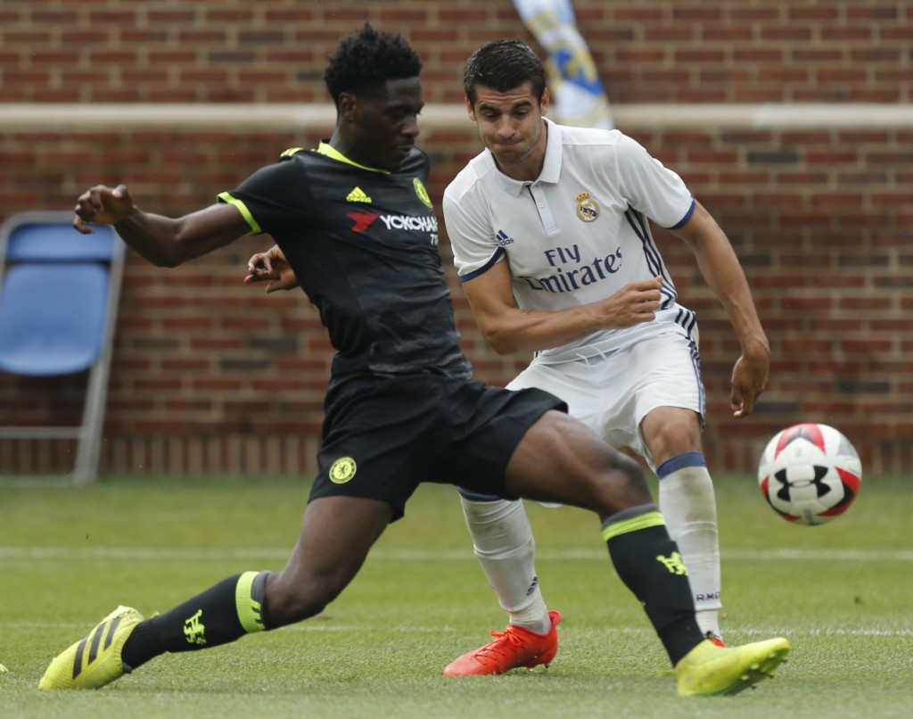 Chelsea defender Ola Aina (L) kicks the ball past Real Madrid forward Alvaro Borja Morata Martin (R) during an International Champions Cup soccer match in Ann Arbor, Michigan on July 30, 2016. / AFP / Jay LaPrete (Photo credit should read JAY LAPRETE/AFP/Getty Images)
