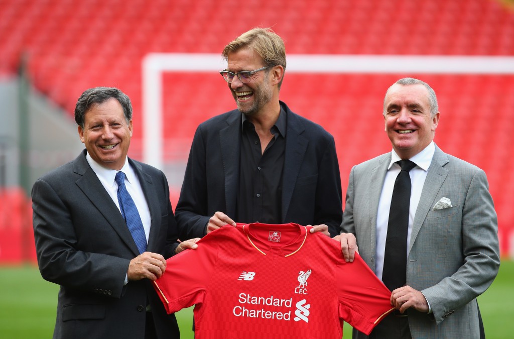 LIVERPOOL, ENGLAND - OCTOBER 09: Jurgen Klopp is unveiled as the new manager of Liverpool FC as he stands alongside Tom Werner (l) the chairman and Ian Ayre (r) the chief executive during a photocall at Anfield on October 9, 2015 in Liverpool, England. (Photo by Alex Livesey/Getty Images)