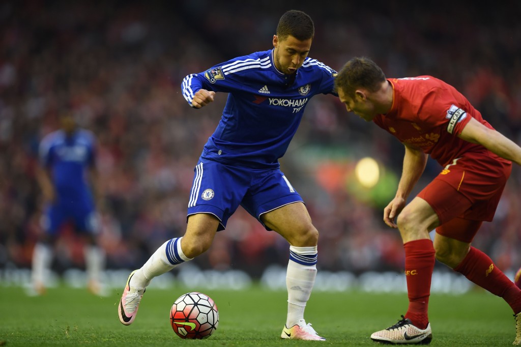 Chelsea's Belgian midfielder Eden Hazard vies with Liverpool's English midfielder James Milner during the English Premier League football match between Liverpool and Chelsea at Anfield in Liverpool, north west England on May 11, 2016. / AFP / Paul ELLIS / RESTRICTED TO EDITORIAL USE. No use with unauthorized audio, video, data, fixture lists, club/league logos or 'live' services. Online in-match use limited to 75 images, no video emulation. No use in betting, games or single club/league/player publications. / (Photo credit should read PAUL ELLIS/AFP/Getty Images)