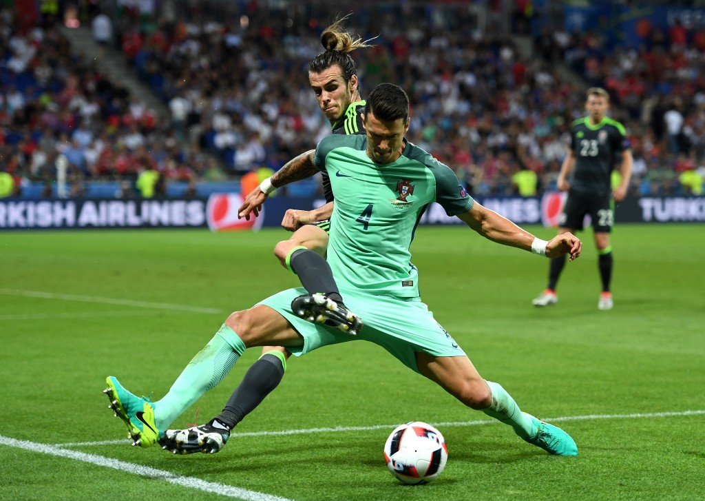 LYON, FRANCE - JULY 06: Gareth Bale of Wales battles for the ball with Jose Fonte of Portugal during the UEFA EURO 2016 semi final match between Portugal and Wales at Stade des Lumieres on July 6, 2016 in Lyon, France. (Photo by Michael Regan/Getty Images)