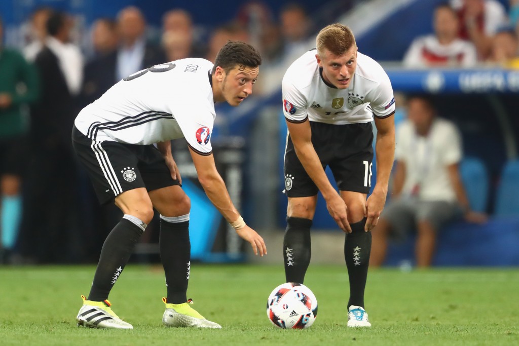 MARSEILLE, FRANCE - JULY 07: Toni Kroos (R) of Germany reacts with his team mate Mesut Oezil during the UEFA EURO semi final match between Germany and France at Stade Velodrome on July 7, 2016 in Marseille, France. (Photo by Alexander Hassenstein/Getty Images)