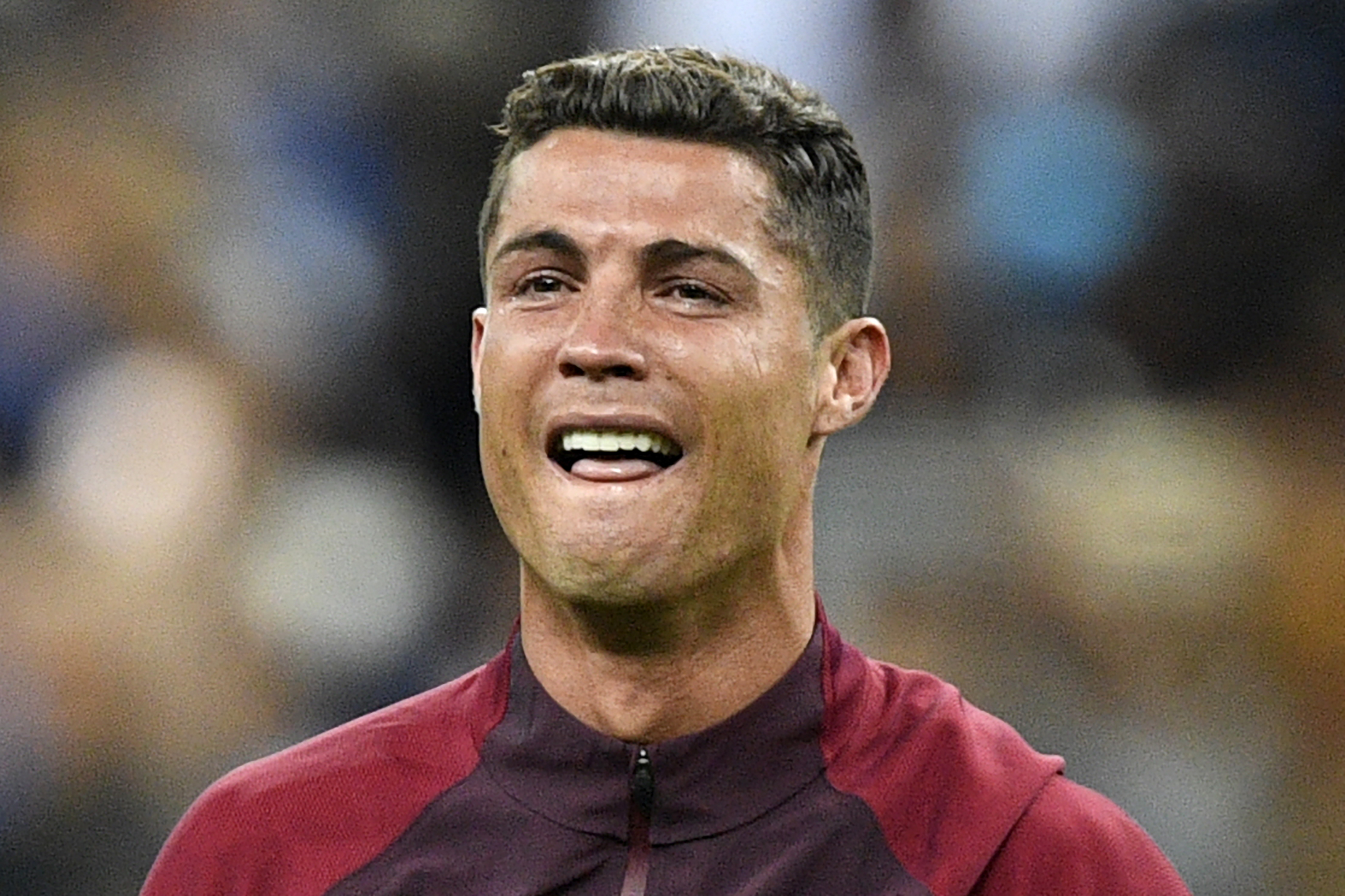 TOPSHOT - Portugal's forward Cristiano Ronaldo reacts as Portugal beats France 1-0 to clinch the Euro 2016 final football match between France and Portugal at the Stade de France in Saint-Denis, north of Paris, on July 10, 2016. / AFP / MARTIN BUREAU        (Photo credit should read MARTIN BUREAU/AFP/Getty Images)