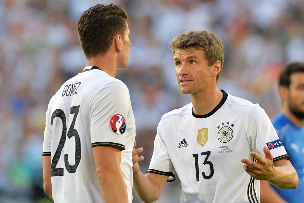 Germany's forward Mario Gomez (L) listens to Germany's midfielder Thomas Mueller during the Euro 2016 quarter-final football match between Germany and Italy at the Matmut Atlantique stadium in Bordeaux on July 2, 2016. / AFP / NICOLAS TUCAT (Photo credit should read NICOLAS TUCAT/AFP/Getty Images)