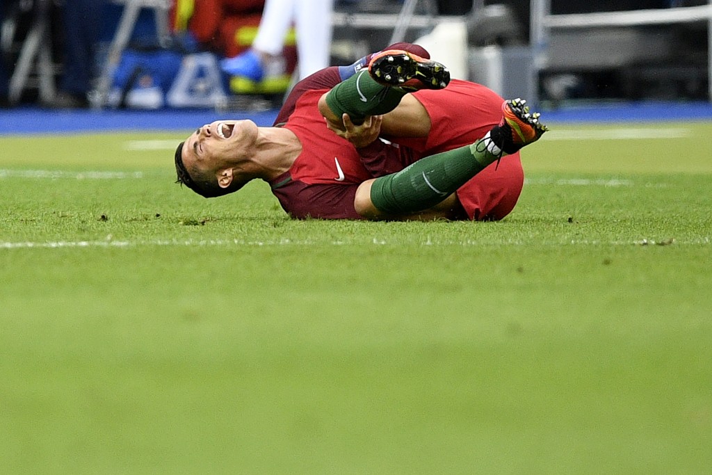 Portugal's forward Cristiano Ronaldo reacts during the Euro 2016 final football match between France and Portugal at the Stade de France in Saint-Denis, north of Paris, on July 10, 2016. / AFP / MARTIN BUREAU (Photo credit should read MARTIN BUREAU/AFP/Getty Images)