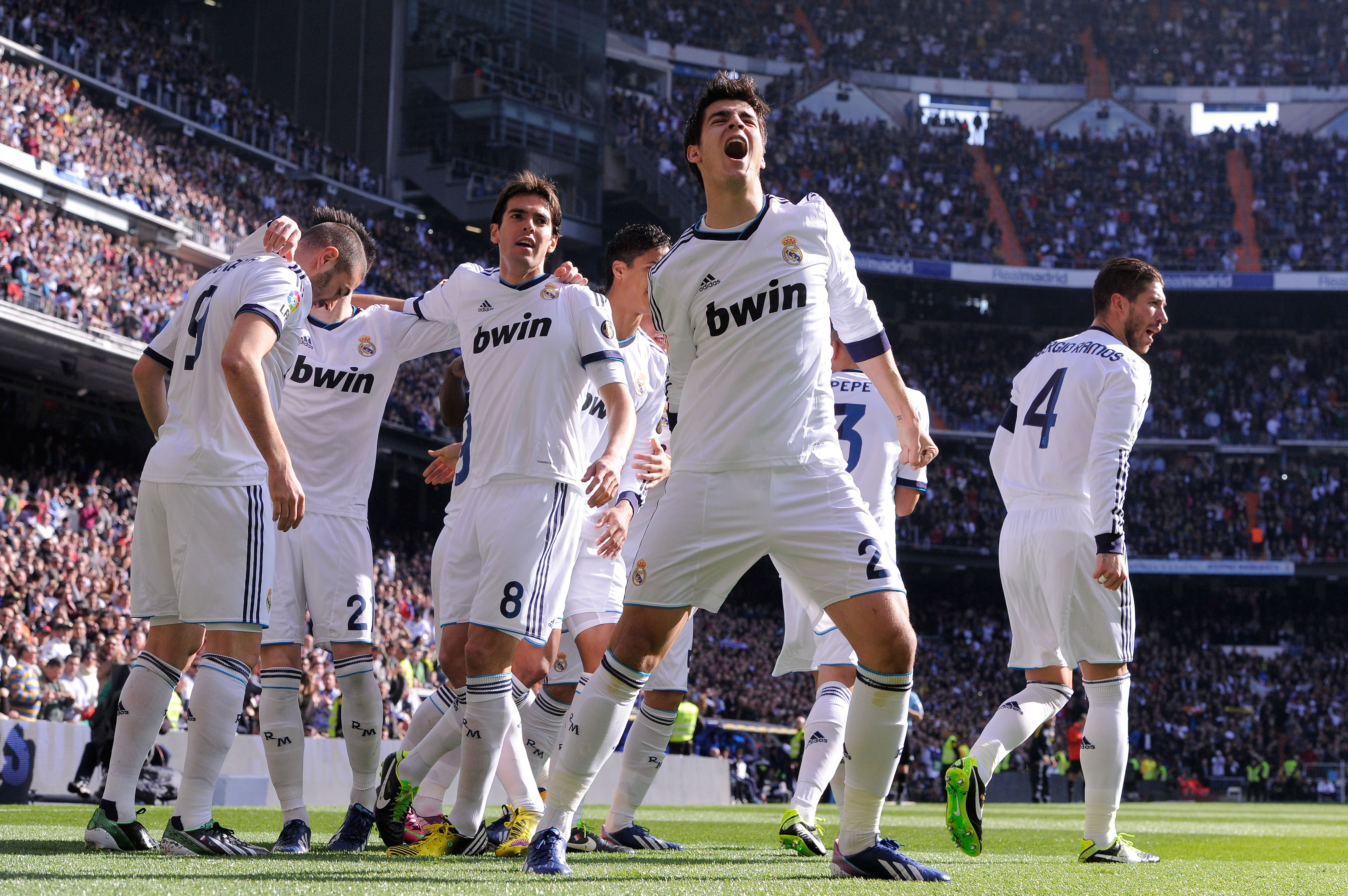 MADRID, SPAIN - MARCH 02: Alvaro Morata (C) of Real Madrid CF celebrates with his teammates after Karim Benzema of Real Madrid CF (L) scored the opening goal during the La Liga match between Real Madrid CF and FC Barcelona at Bernabeu on March 2, 2013 in Madrid, Spain. (Photo by David Ramos/Getty Images)
