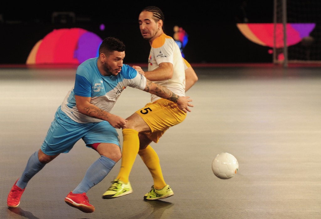 Fogila (L) from the Mumbai 5's plays against Chennai 5's Romulu the during their Premier Futsal Football League match in Chennai on July 15, 2016. Mumbai beat Chennai 4-2. / AFP / ARUN SANKAR (Photo credit should read ARUN SANKAR/AFP/Getty Images)