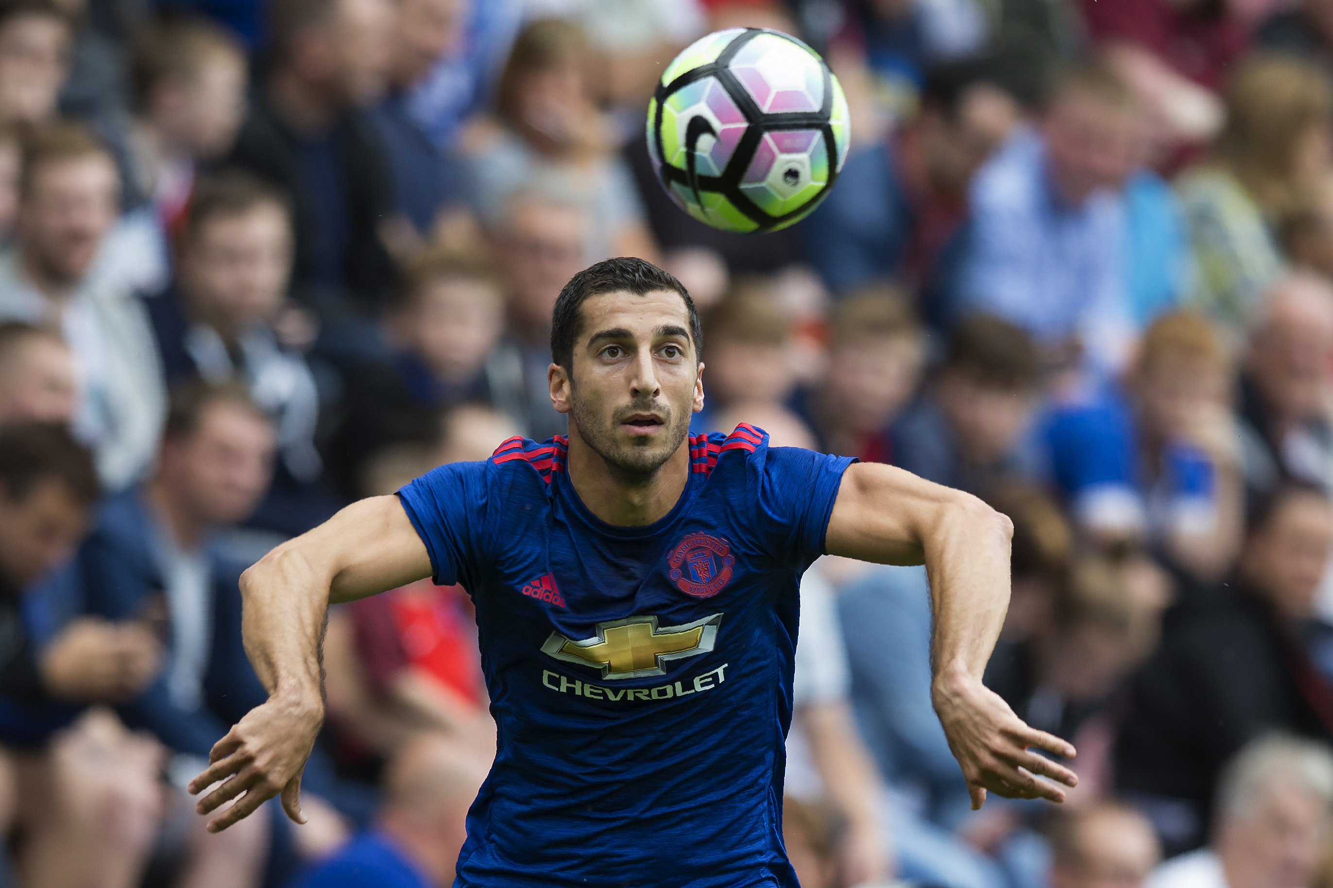 Manchester United's Armenian midfielder Henrikh Mkhitaryan controls the ball during the pre-season friendly football match between Wigan Athletic and Manchester United at the DW stadium in Wigan, northwest England, on July 16, 2016. / AFP / JON SUPER / RESTRICTED TO EDITORIAL USE. No use with unauthorized audio, video, data, fixture lists, club/league logos or 'live' services. Online in-match use limited to 75 images, no video emulation. No use in betting, games or single club/league/player publications. / (Photo credit should read JON SUPER/AFP/Getty Images)