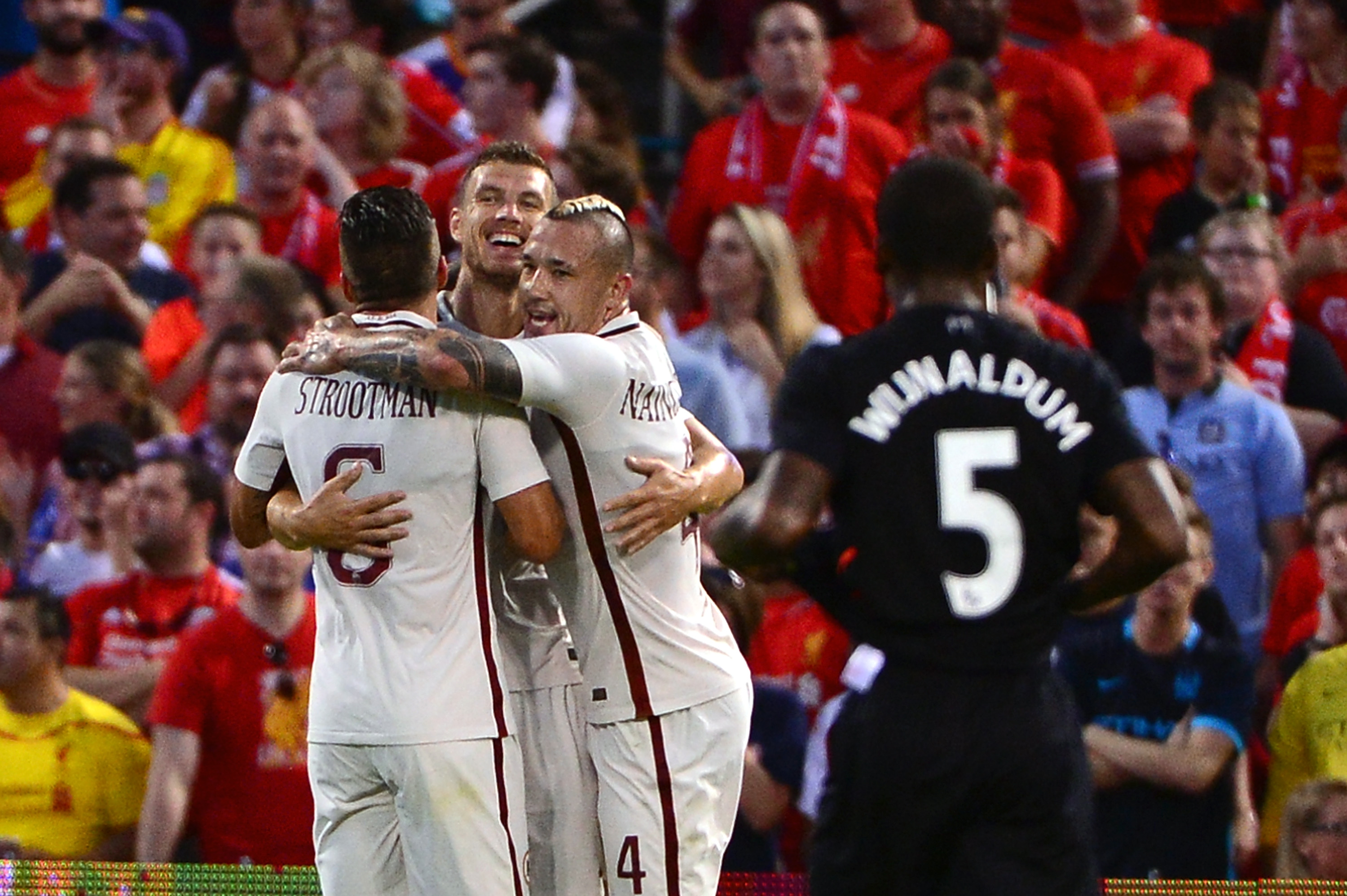 ST LOUIS, MO - AUGUST 01: Edin Dzeko #9 of AS Roma celebrates with teammates after scoring a goal against Liverpool FC during a friendly match at Busch Stadium on August 1, 2016 in St Louis, Missouri. AC Roma won 2-1. (Photo by Jeff Curry/Getty Images)