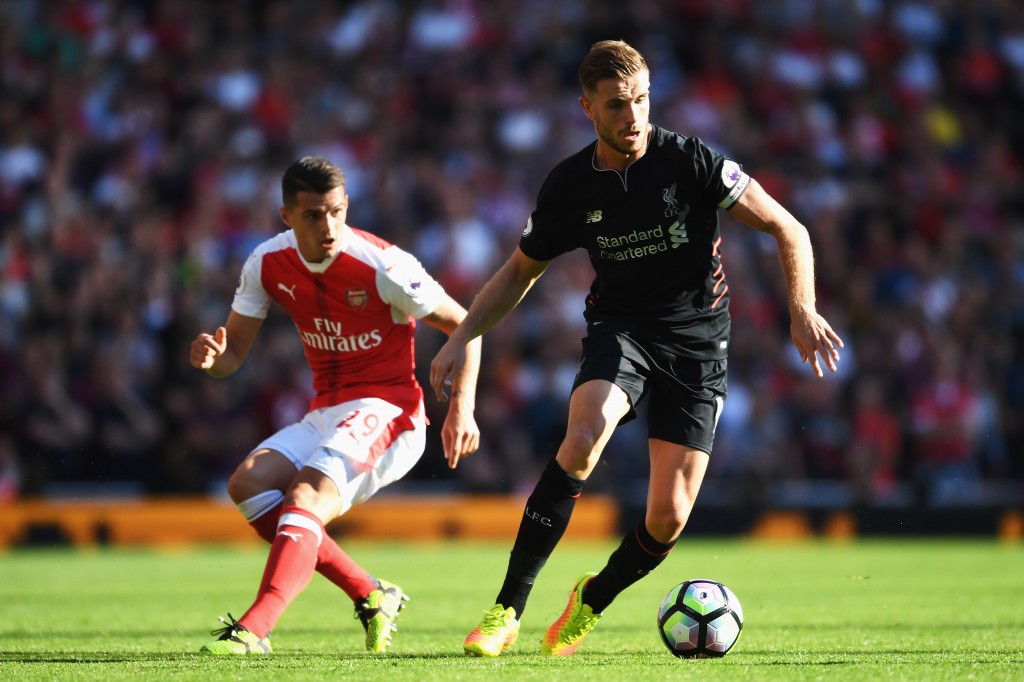 LONDON, ENGLAND - AUGUST 14: Jordan Henderson of Liverpool is closed down by Granit Xhaka of Arsenal during the Premier League match between Arsenal and Liverpool at Emirates Stadium on August 14, 2016 in London, England. (Photo by Mike Hewitt/Getty Images)